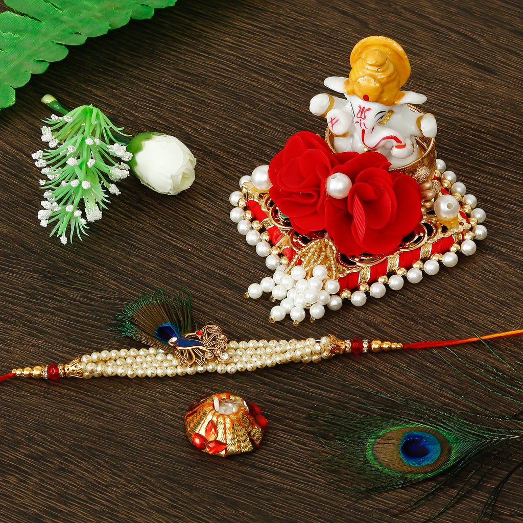 Designer Pearl Morpankh Rakhi with Lord Ganesha Idol on Decorative Plate for Car & Home and Roli Tikka Matki Kafalo