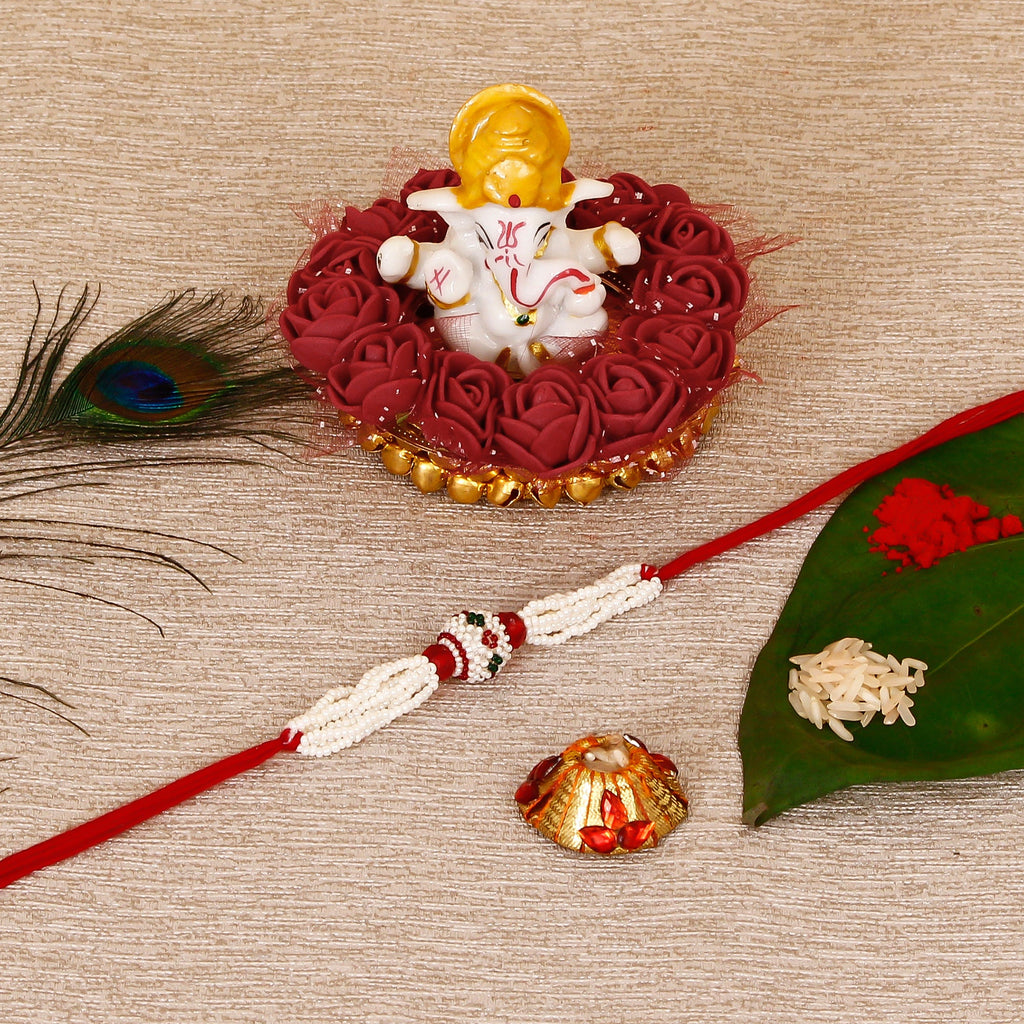 Designer Pearl Rakhi with Lord Ganesha Idol on Decorative Plate for Car & Home and Roli Tikka Matki Kafalo