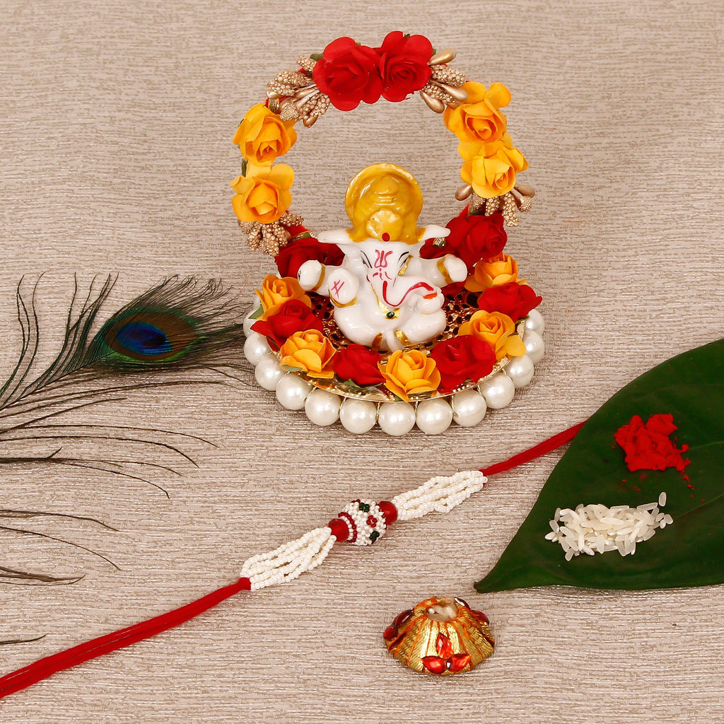 Designer Pearl Rakhi with Lord Ganesha Idol on Decorative Plate for Car & Home and Roli Tikka Matki Kafalo