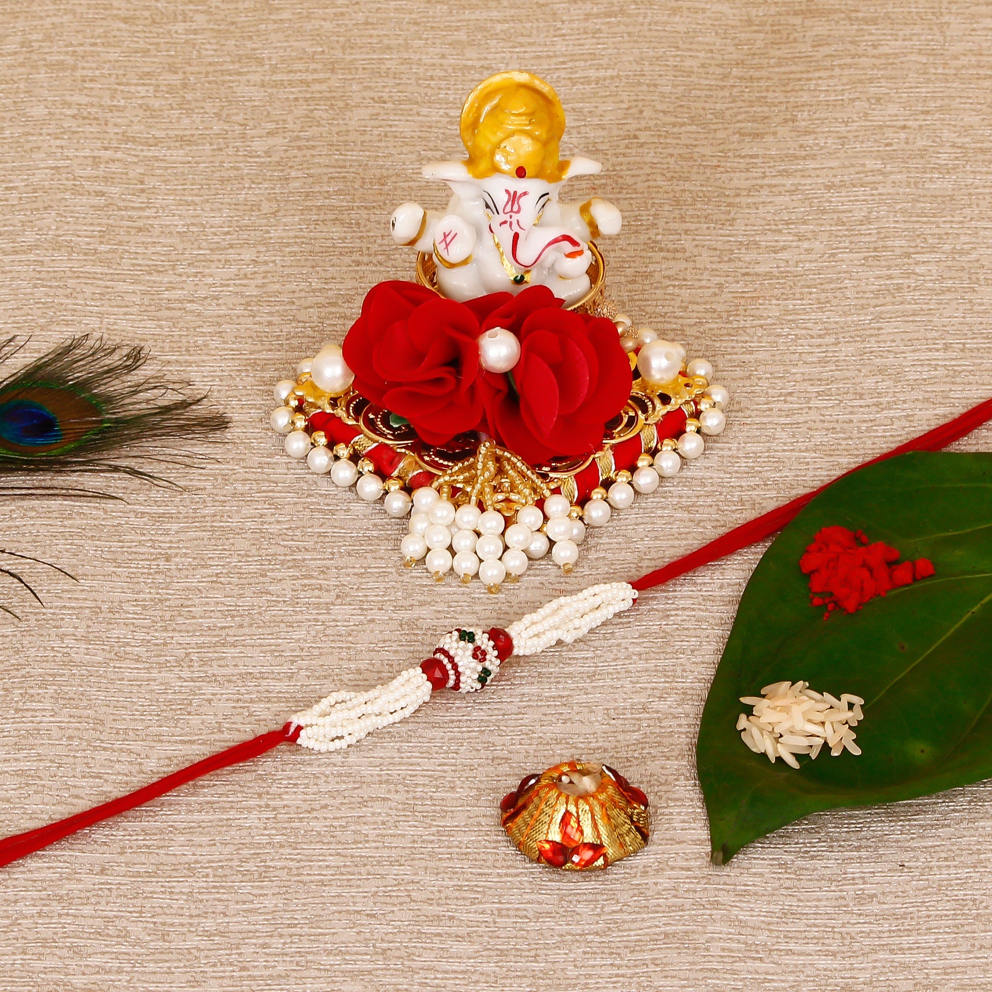 Designer Pearl Rakhi with Lord Ganesha Idol on Decorative Plate for Car & Home and Roli Tikka Matki Kafalo