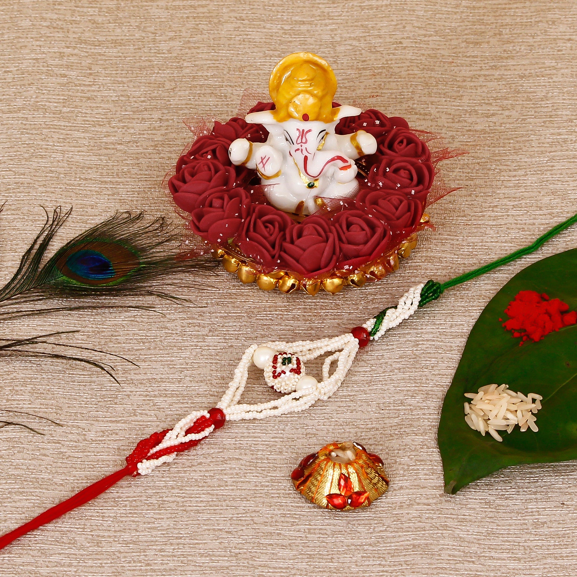 Designer Pearl Rakhi with Lord Ganesha Idol on Decorative Plate for Car & Home and Roli Tikka Matki Kafalo