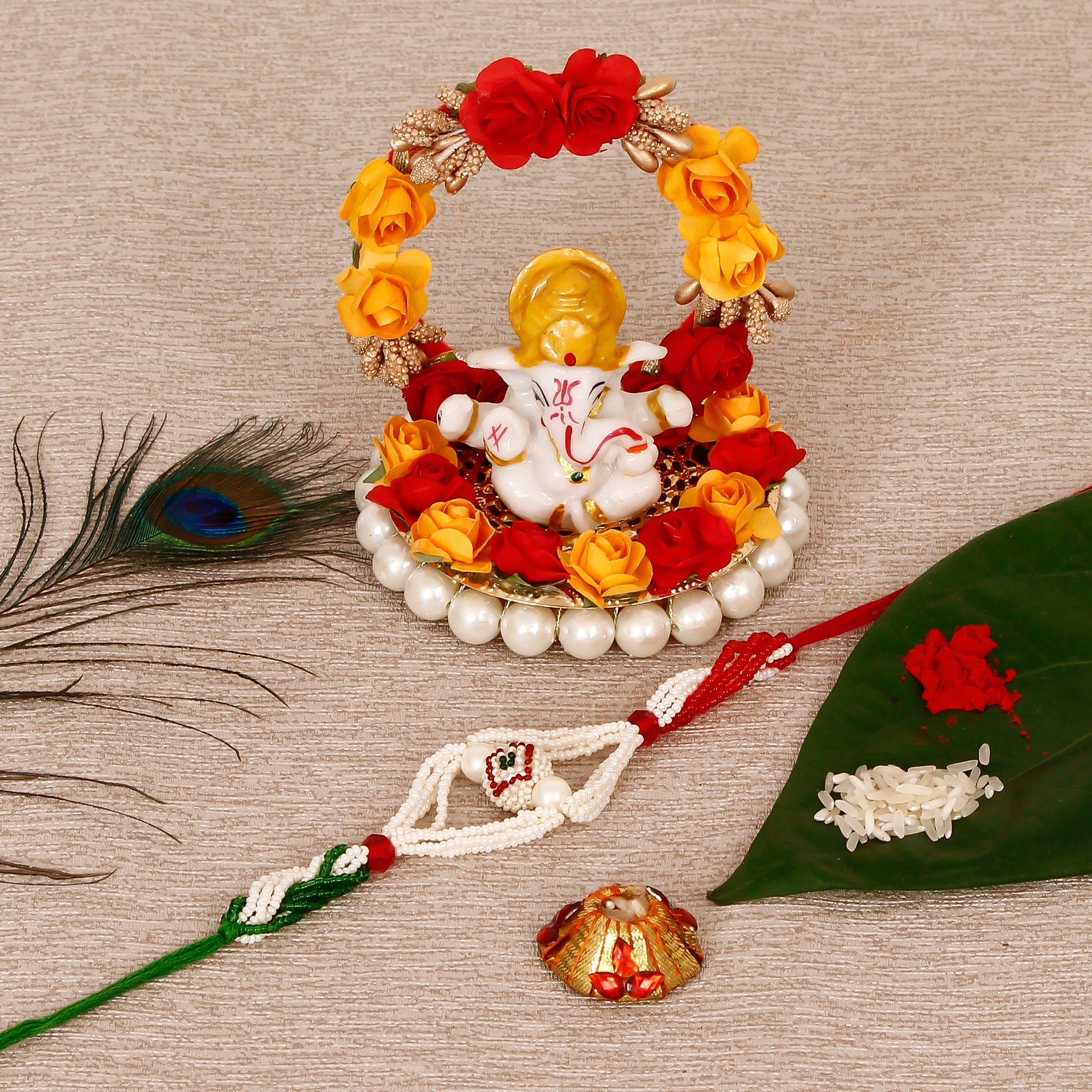 Designer Pearl Rakhi with Lord Ganesha Idol on Decorative Plate for Car & Home and Roli Tikka Matki Kafalo