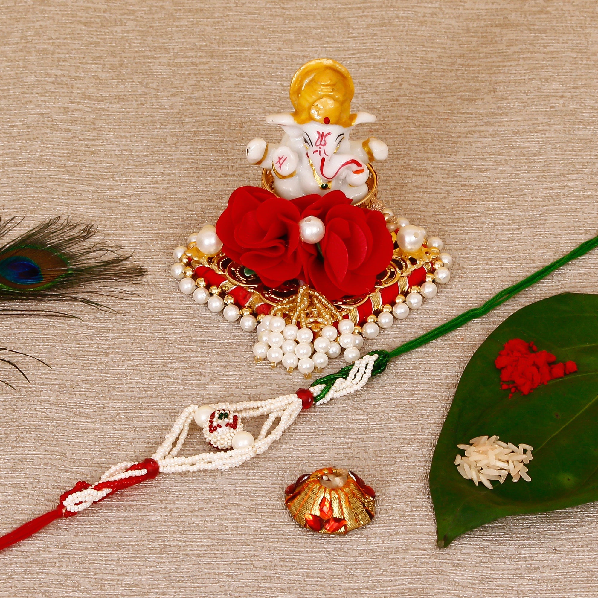 Designer Pearl Rakhi with Lord Ganesha Idol on Decorative Plate for Car & Home and Roli Tikka Matki Kafalo
