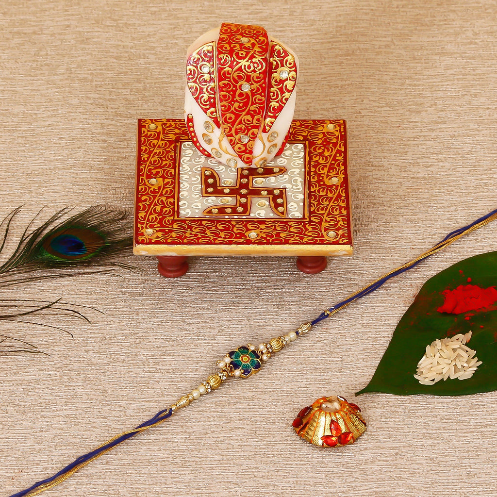 Designer Meenakari Rakhi with Ridhi Sidhi Marble chowki and Roli Tikka Matki Kafalo