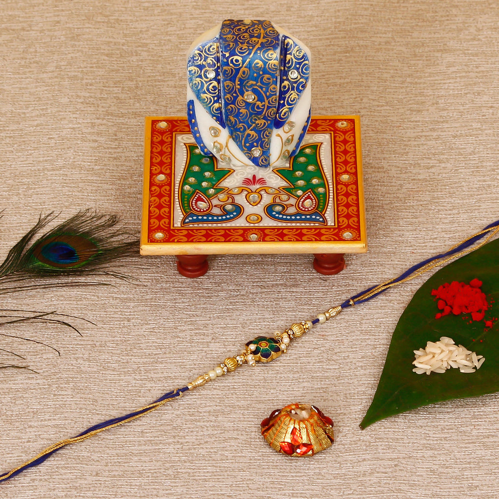 Designer Meenakari Rakhi with Lord Ganesha on Marble Chowki and Roli Tikka Matki Kafalo