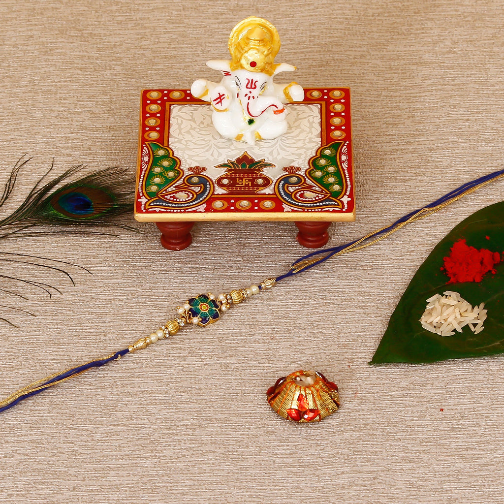 Designer Meenakari Rakhi with Lord Ganesha Marble Chowki and Roli Tikka Matki Kafalo