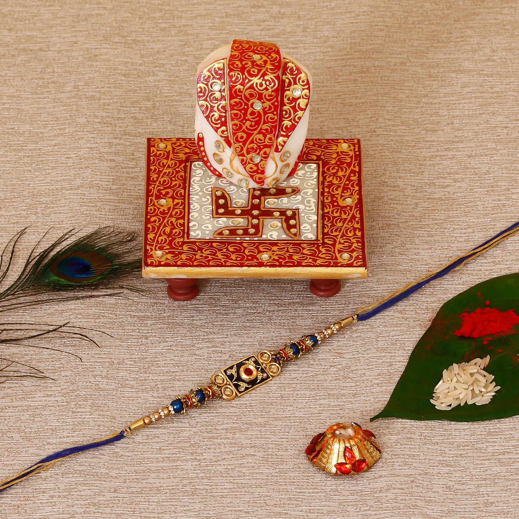 Designer Meenakari Rakhi with Ridhi Sidhi Marble chowki and Roli Tikka Matki Kafalo