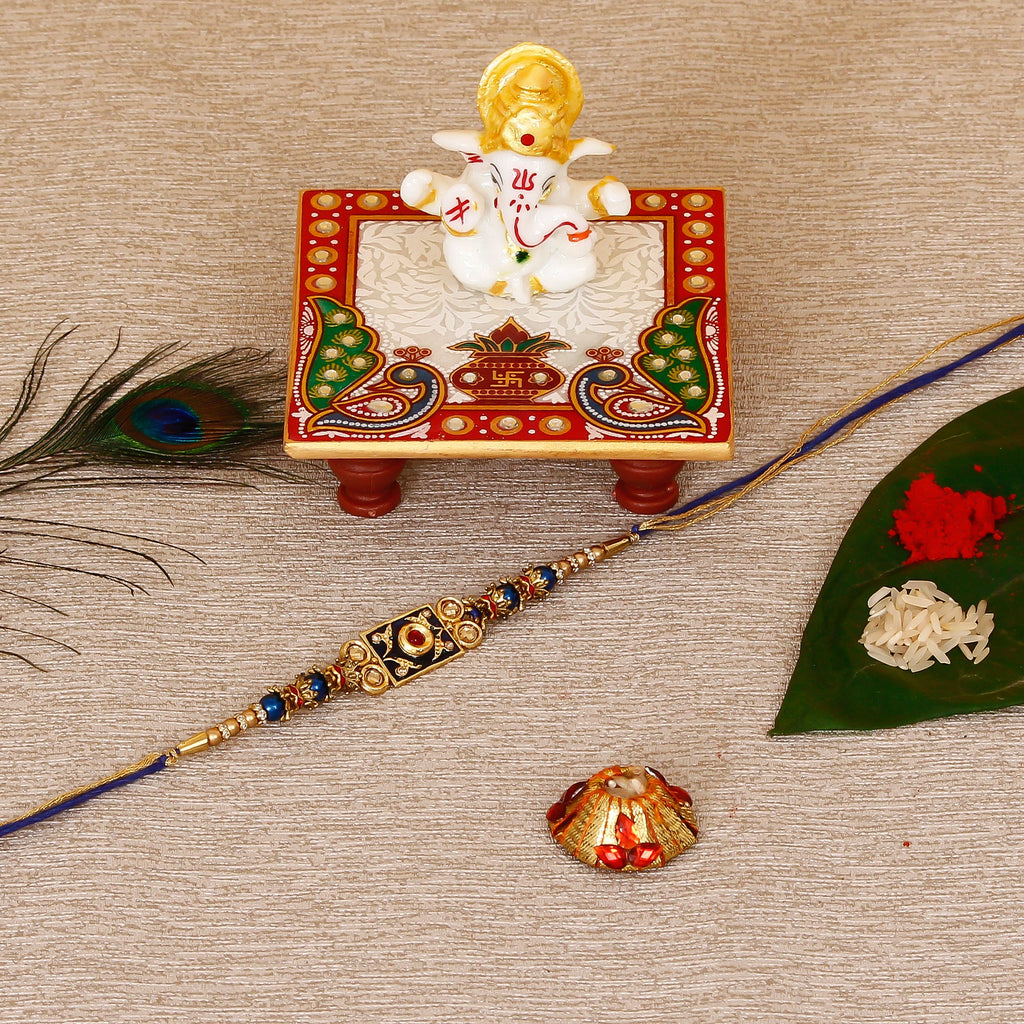 Designer Meenakari Rakhi with Lord Ganesha Marble Chowki and Roli Tikka Matki Kafalo