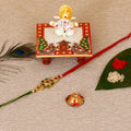 Designer Kundan Rakhi with Lord Ganesha Marble Chowki and Roli Tikka Matki Kafalo