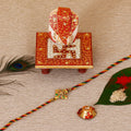 Designer Religious Swastik Rakhi with Ridhi Sidhi Marble chowki and Roli Tikka Matki Kafalo