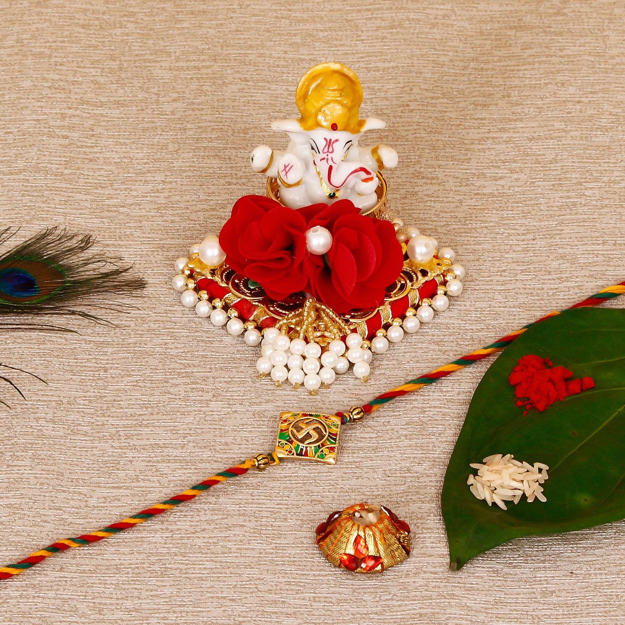 Designer Religious Swastik Rakhi with Lord Ganesha Idol on Decorative Plate for Car & Home and Roli Tikka Matki Kafalo
