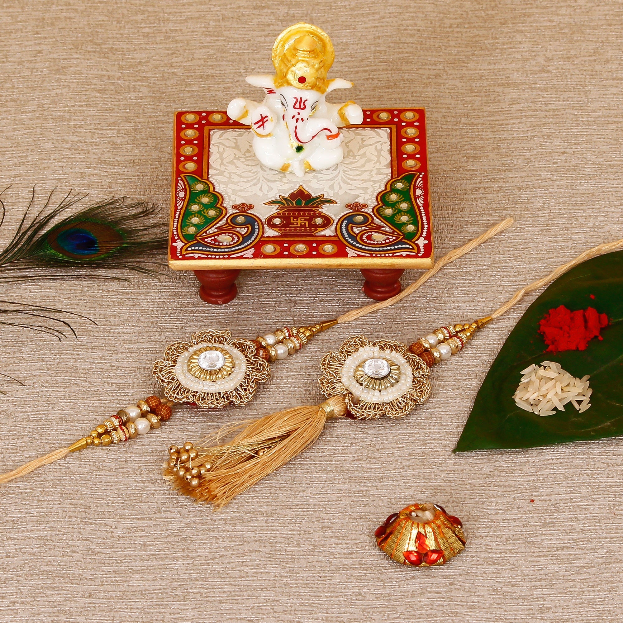 Designer Bhaiya Bhabhi Rakhi with Lord Ganesha Marble Chowki and Roli Tikka Matki Kafalo