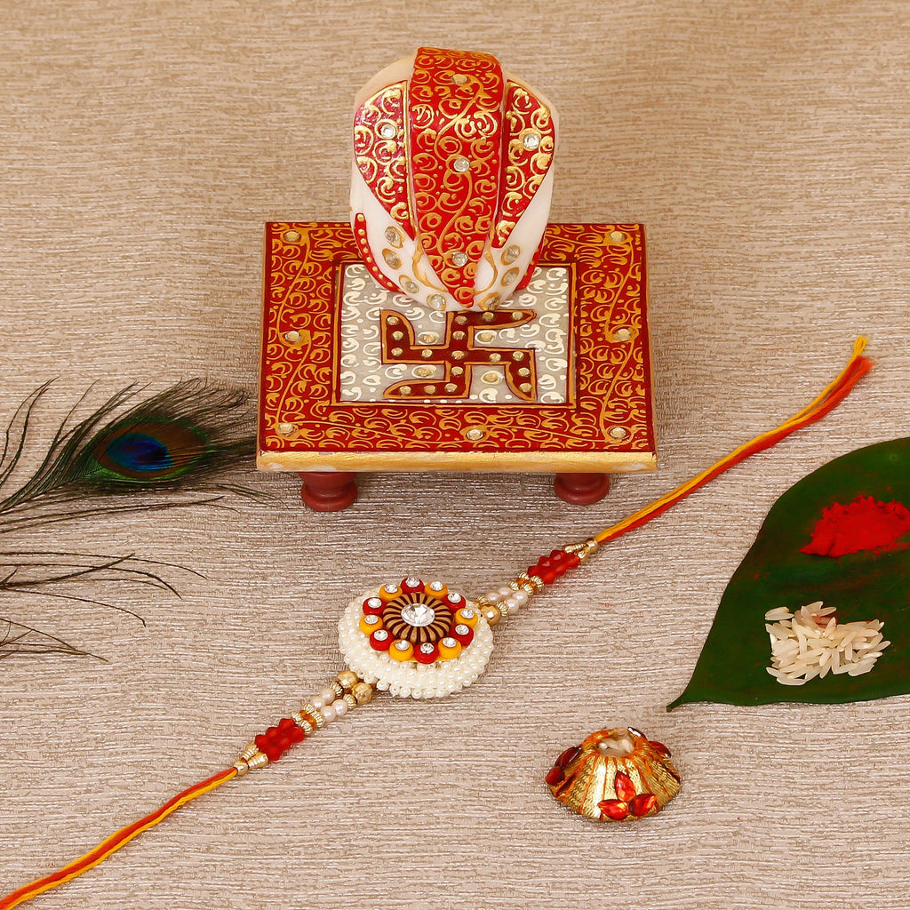 Designer Rakhi with Ridhi Sidhi Marble chowki and Roli Tikka Matki Kafalo