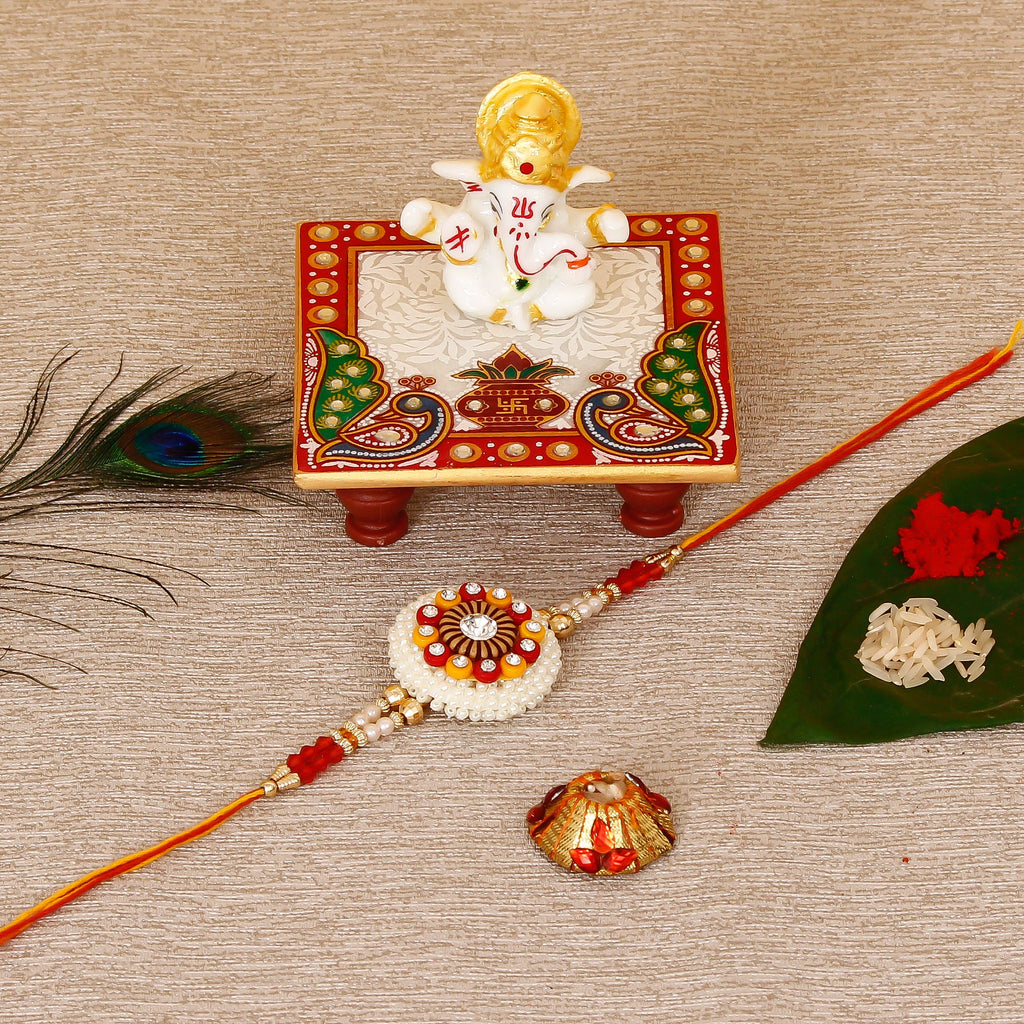 Designer Rakhi with Lord Ganesha Marble Chowki and Roli Tikka Matki Kafalo