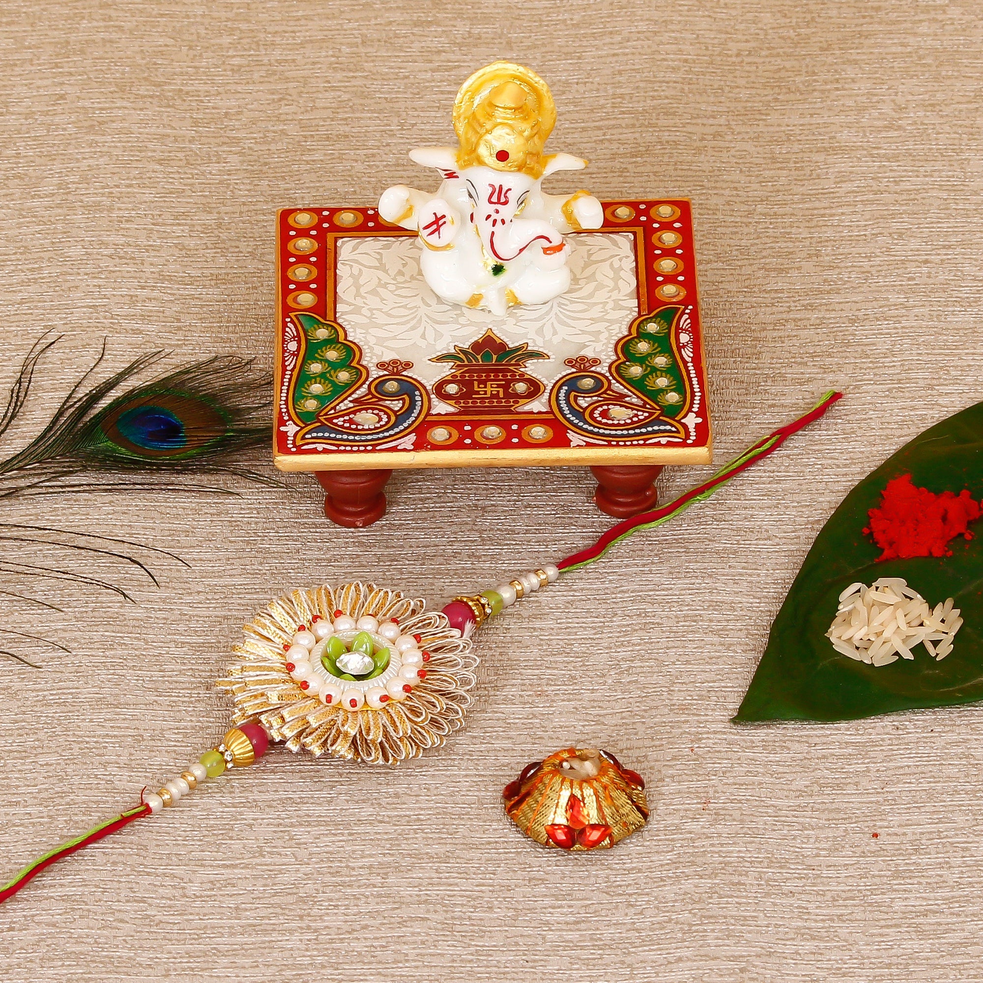 Designer Rakhi with Lord Ganesha Marble Chowki and Roli Tikka Matki Kafalo