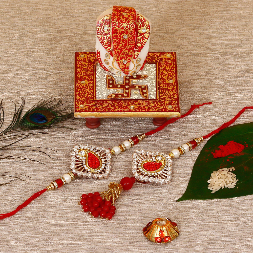 Designer Bhaiya Bhabhi Rakhi with Ridhi Sidhi Marble chowki and Roli Tikka Matki Kafalo