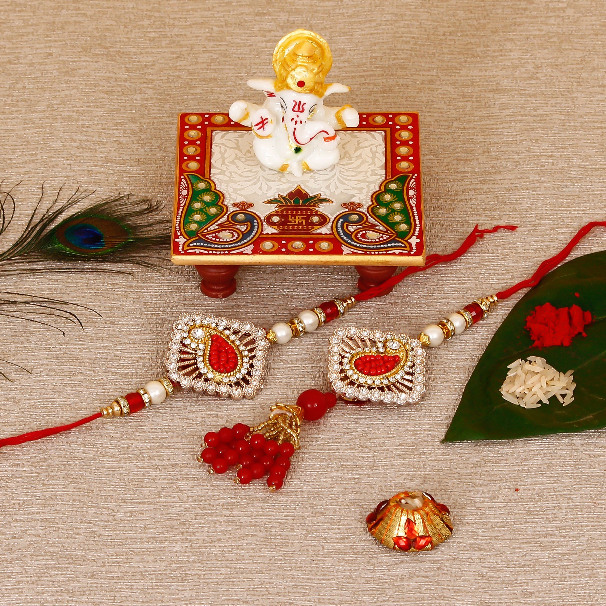Designer Bhaiya Bhabhi Rakhi with Lord Ganesha Marble Chowki and Roli Tikka Matki Kafalo