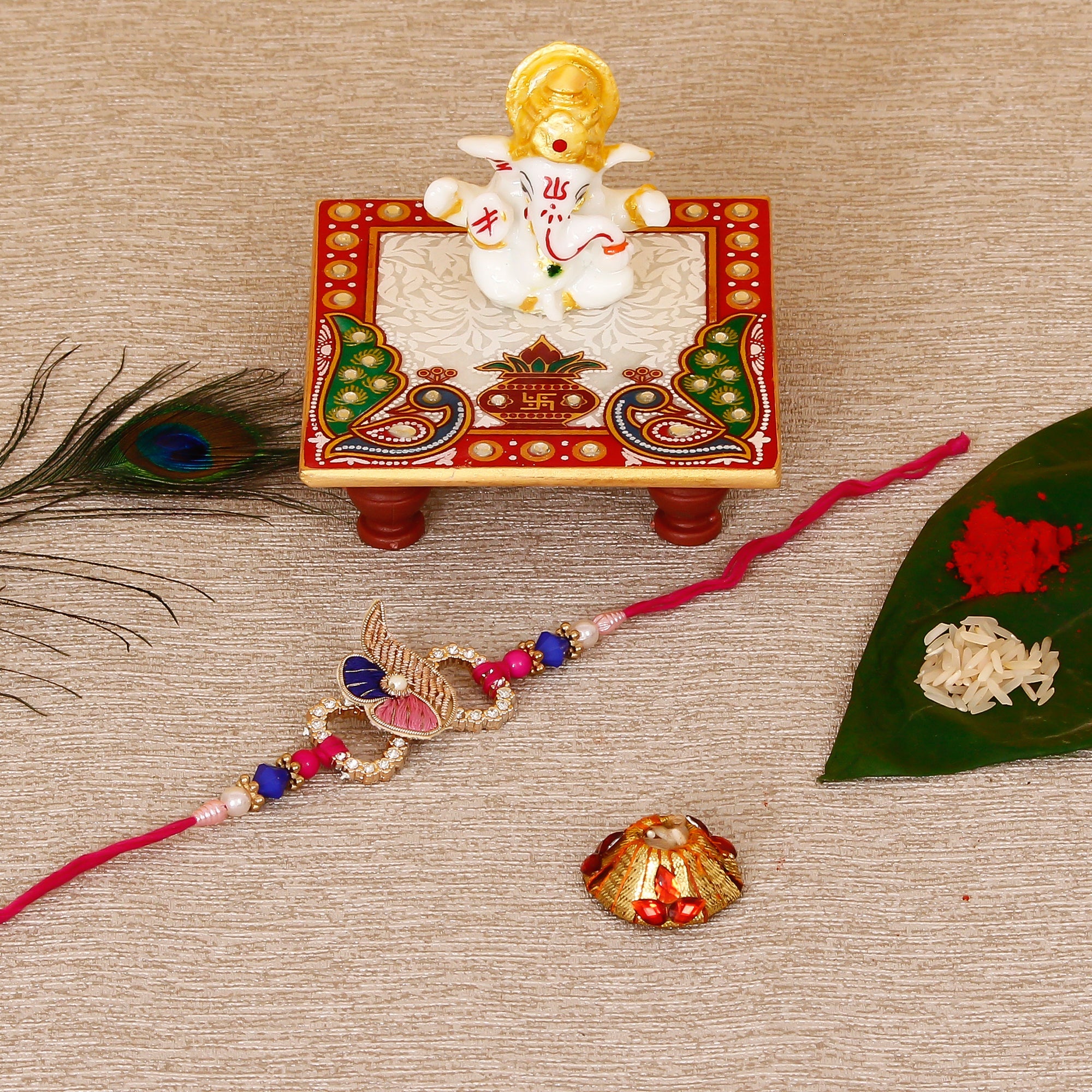 Designer Rakhi with Lord Ganesha Marble Chowki and Roli Tikka Matki Kafalo