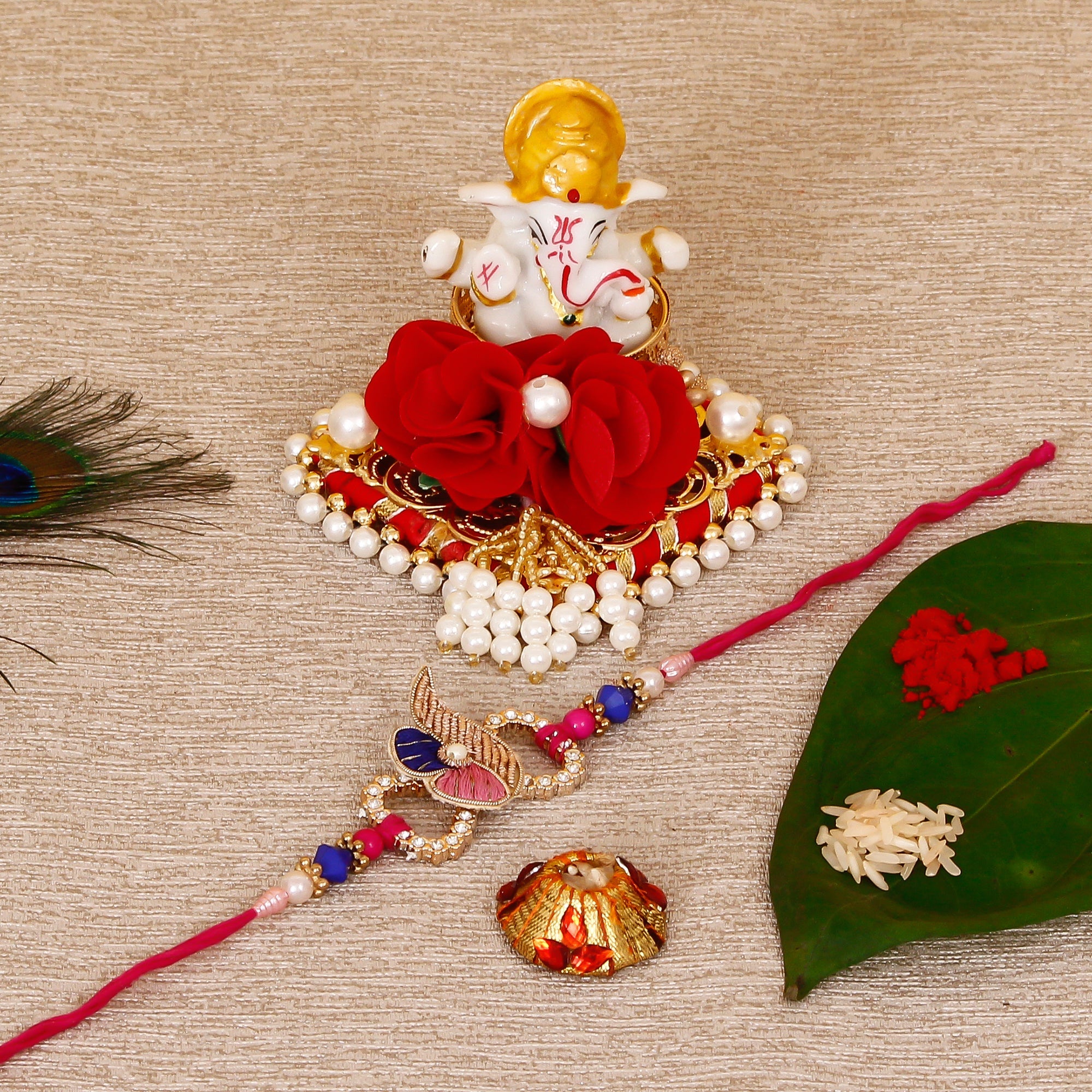 Designer Rakhi with Lord Ganesha Idol on Decorative Plate for Car & Home and Roli Tikka Matki Kafalo