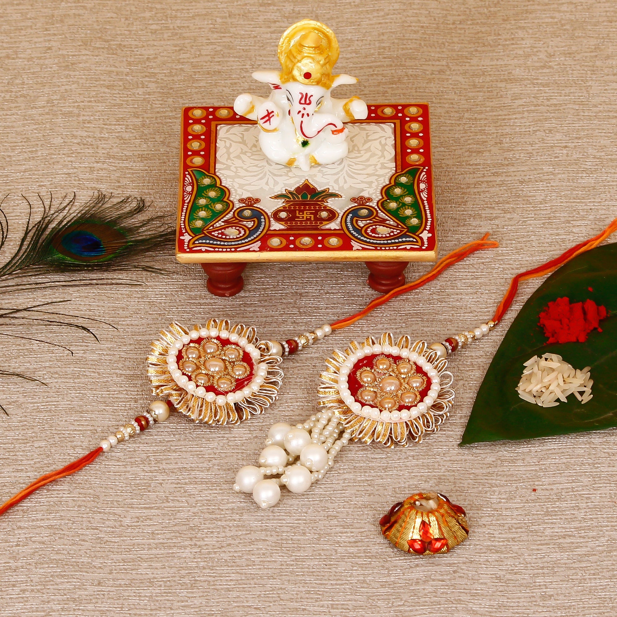 Designer Bhaiya Bhabhi Rakhi with Lord Ganesha Marble Chowki and Roli Tikka Matki Kafalo