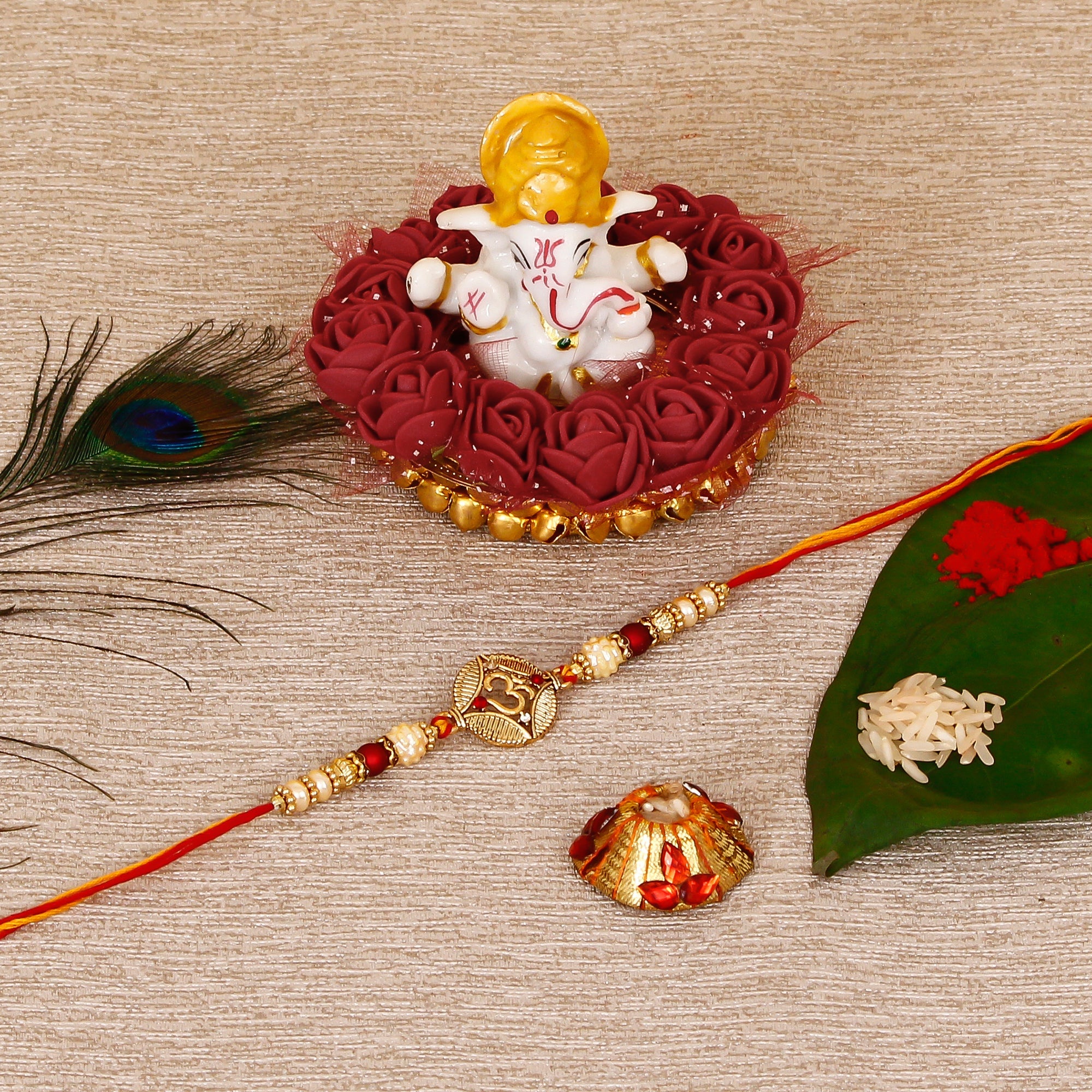 Designer OM Rakhi with Lord Ganesha Idol on Decorative Plate for Car & Home and Roli Tikka Matki Kafalo