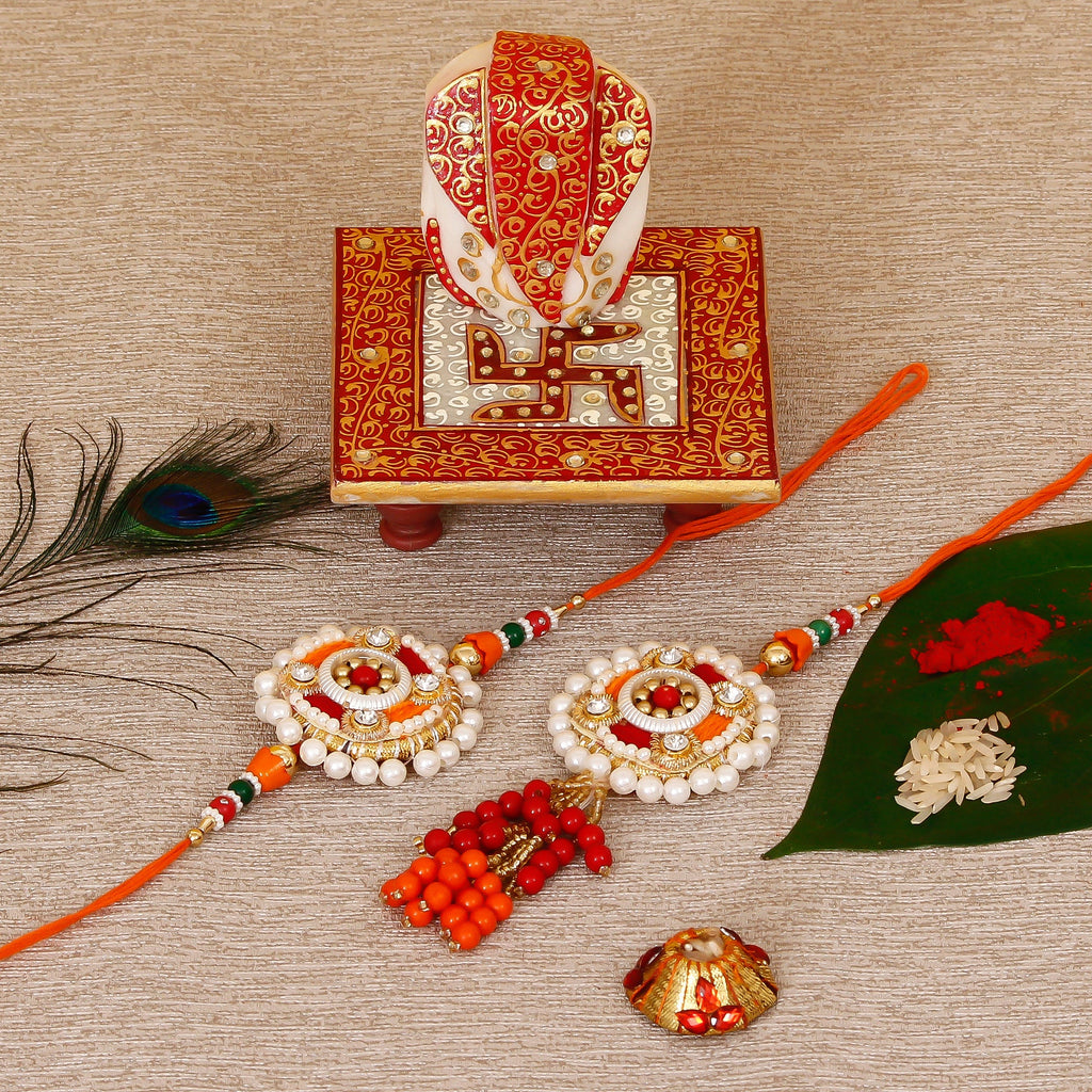 Designer Bhaiya Bhabhi Rakhi with Ridhi Sidhi Marble chowki and Roli Tikka Matki Kafalo