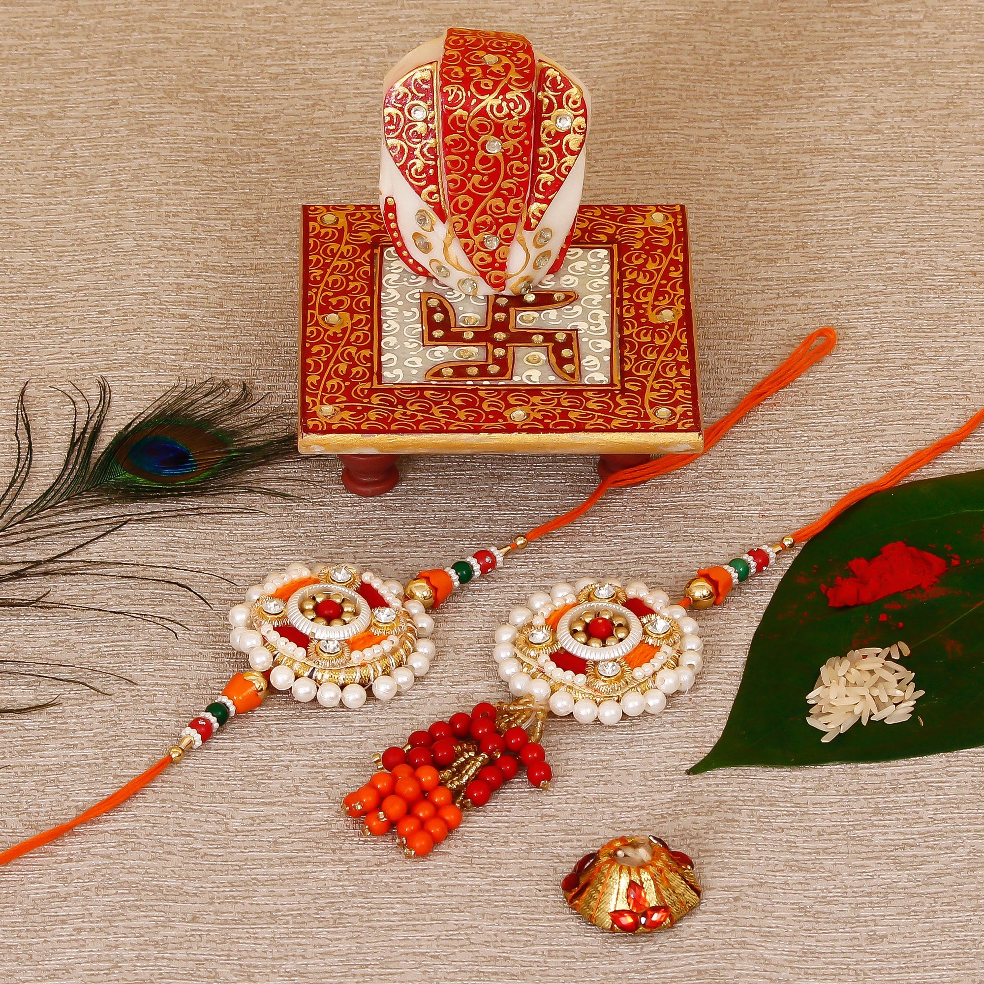Designer Bhaiya Bhabhi Rakhi with Ridhi Sidhi Marble chowki and Roli Tikka Matki Kafalo