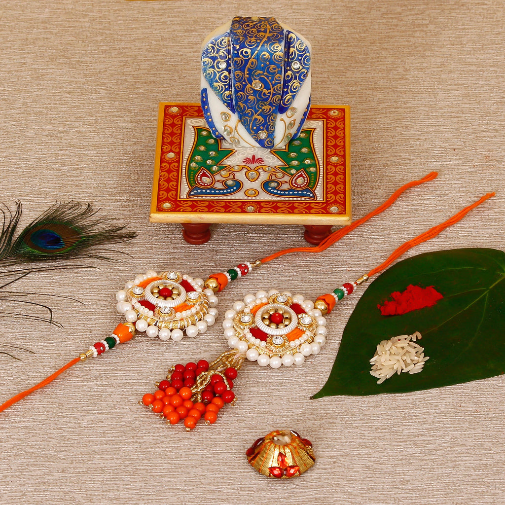 Designer Bhaiya Bhabhi Rakhi with Lord Ganesha on Marble Chowki and Roli Tikka Matki Kafalo