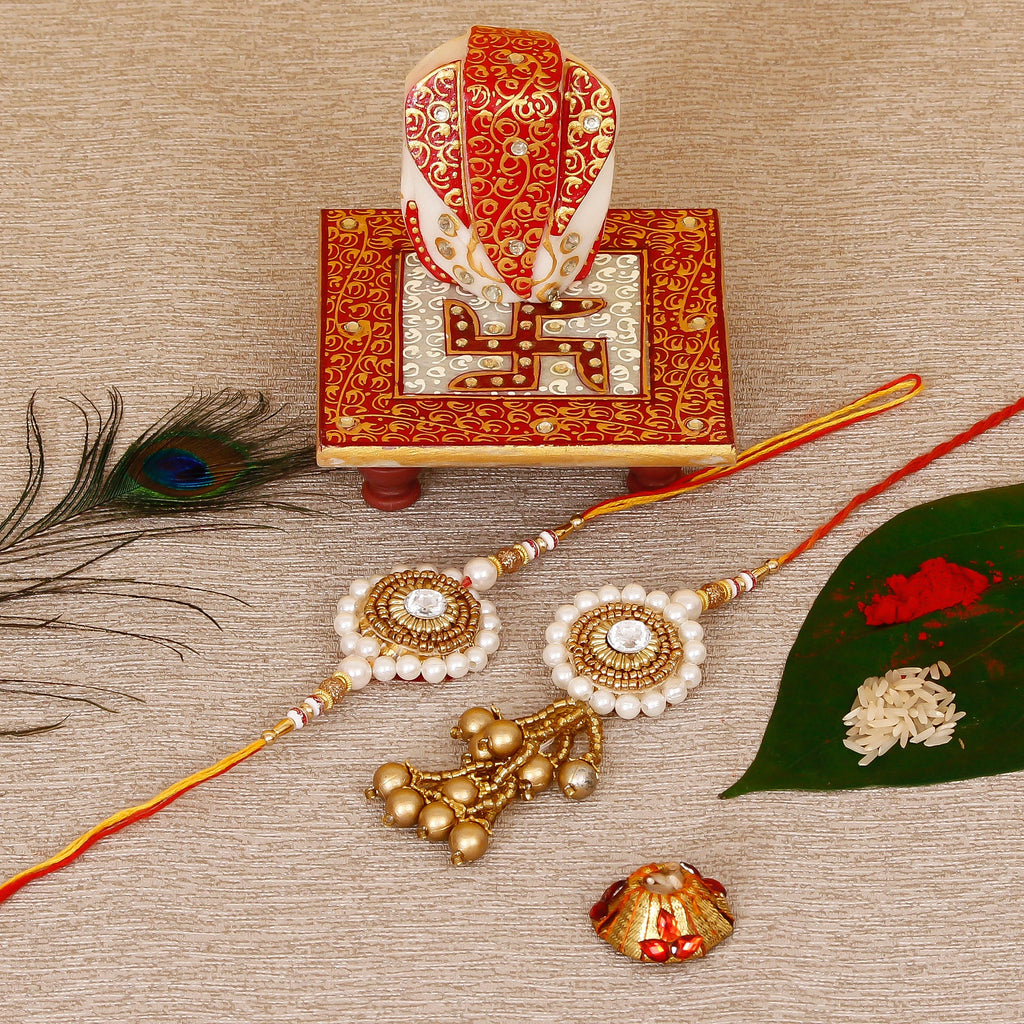Designer Bhaiya Bhabhi Rakhi with Ridhi Sidhi Marble chowki and Roli Tikka Matki Kafalo