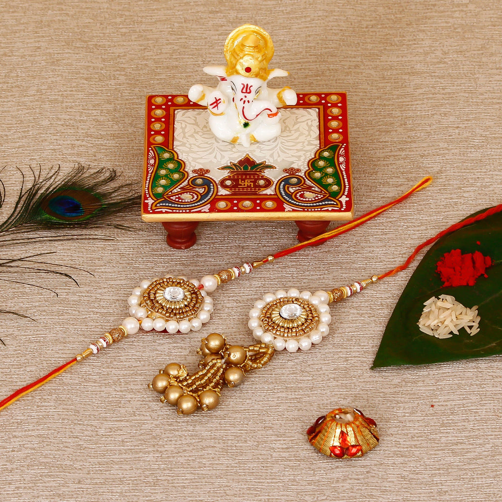 Designer Bhaiya Bhabhi Rakhi with Lord Ganesha Marble Chowki and Roli Tikka Matki Kafalo