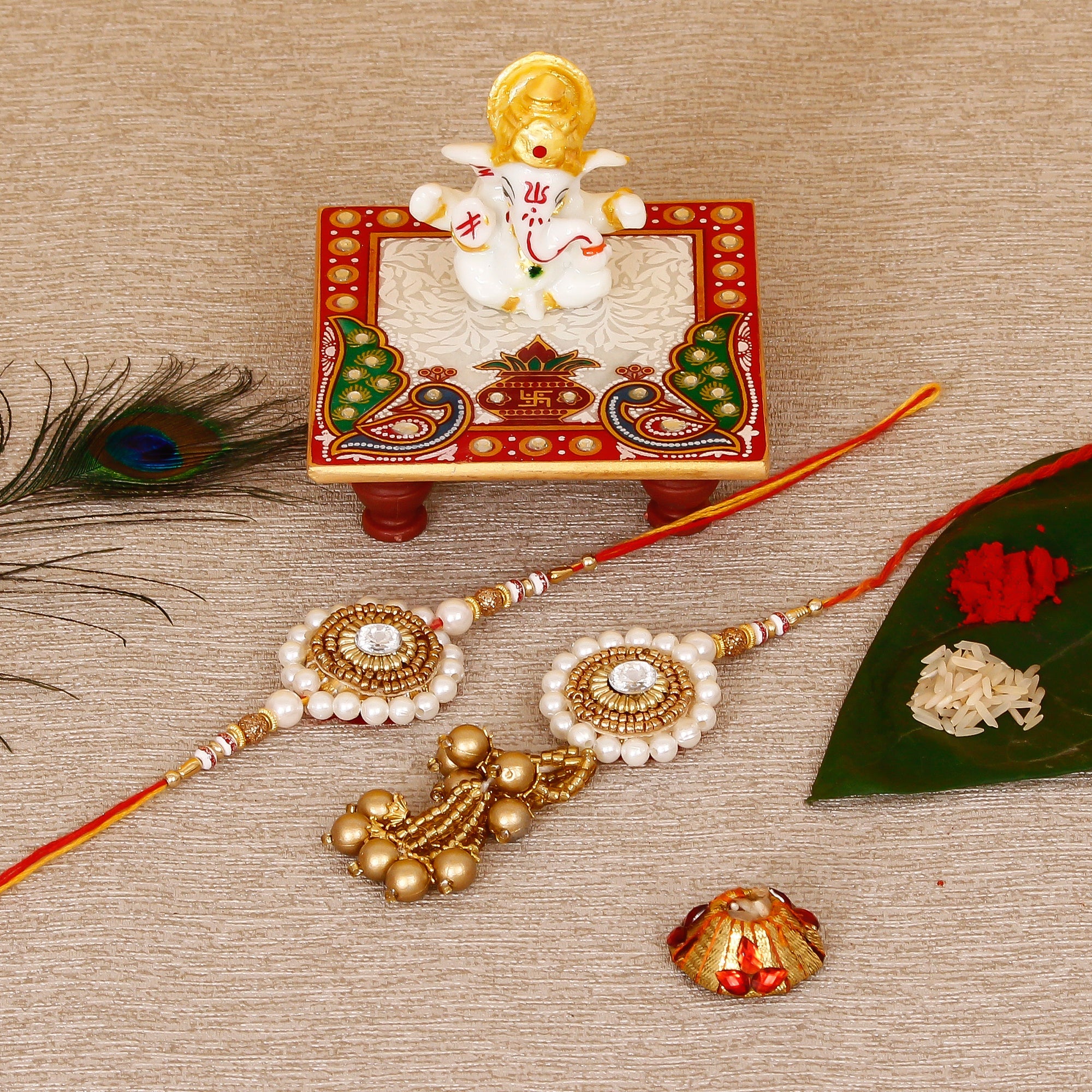 Designer Bhaiya Bhabhi Rakhi with Lord Ganesha Marble Chowki and Roli Tikka Matki Kafalo