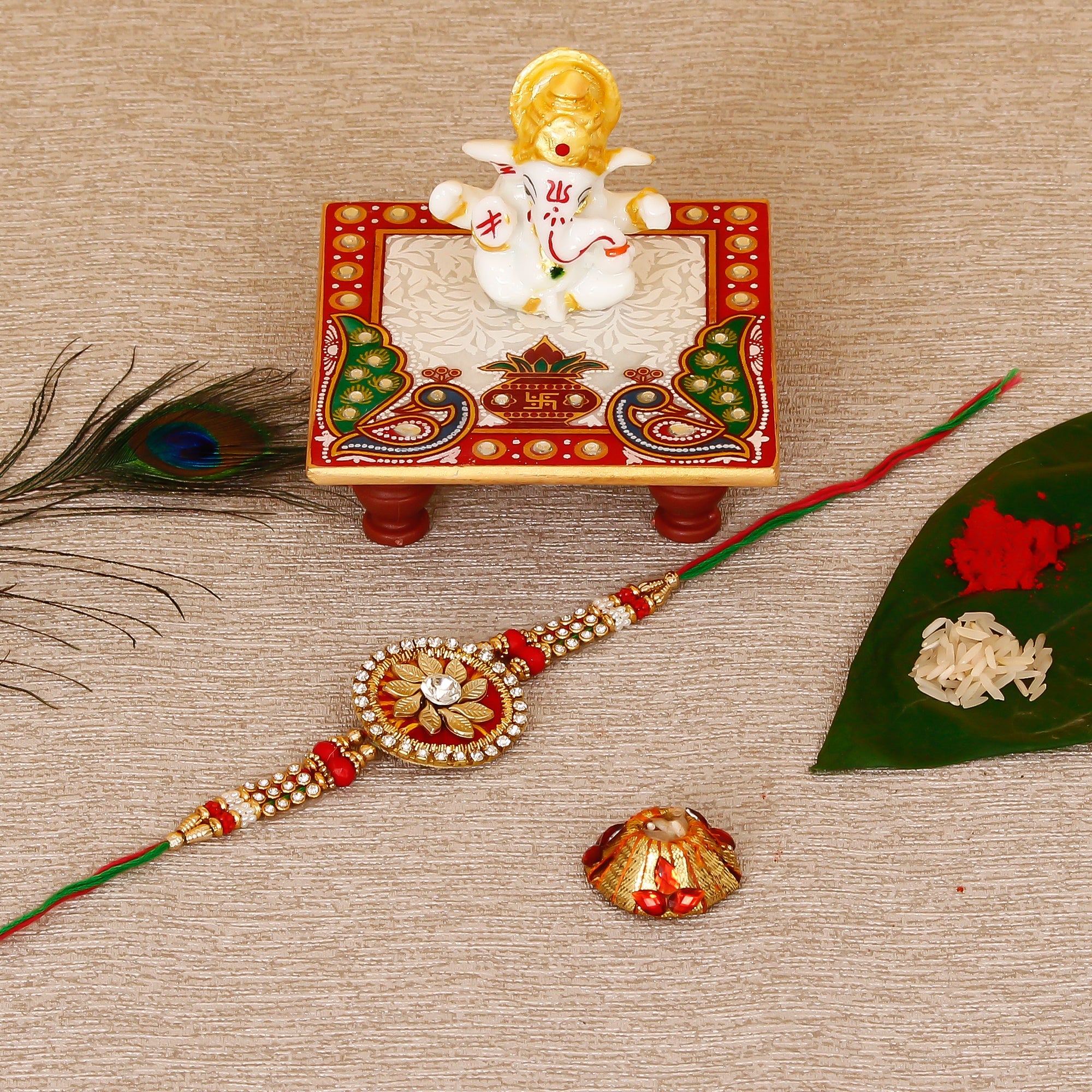 Designer Rakhi with Lord Ganesha Marble Chowki and Roli Tikka Matki Kafalo
