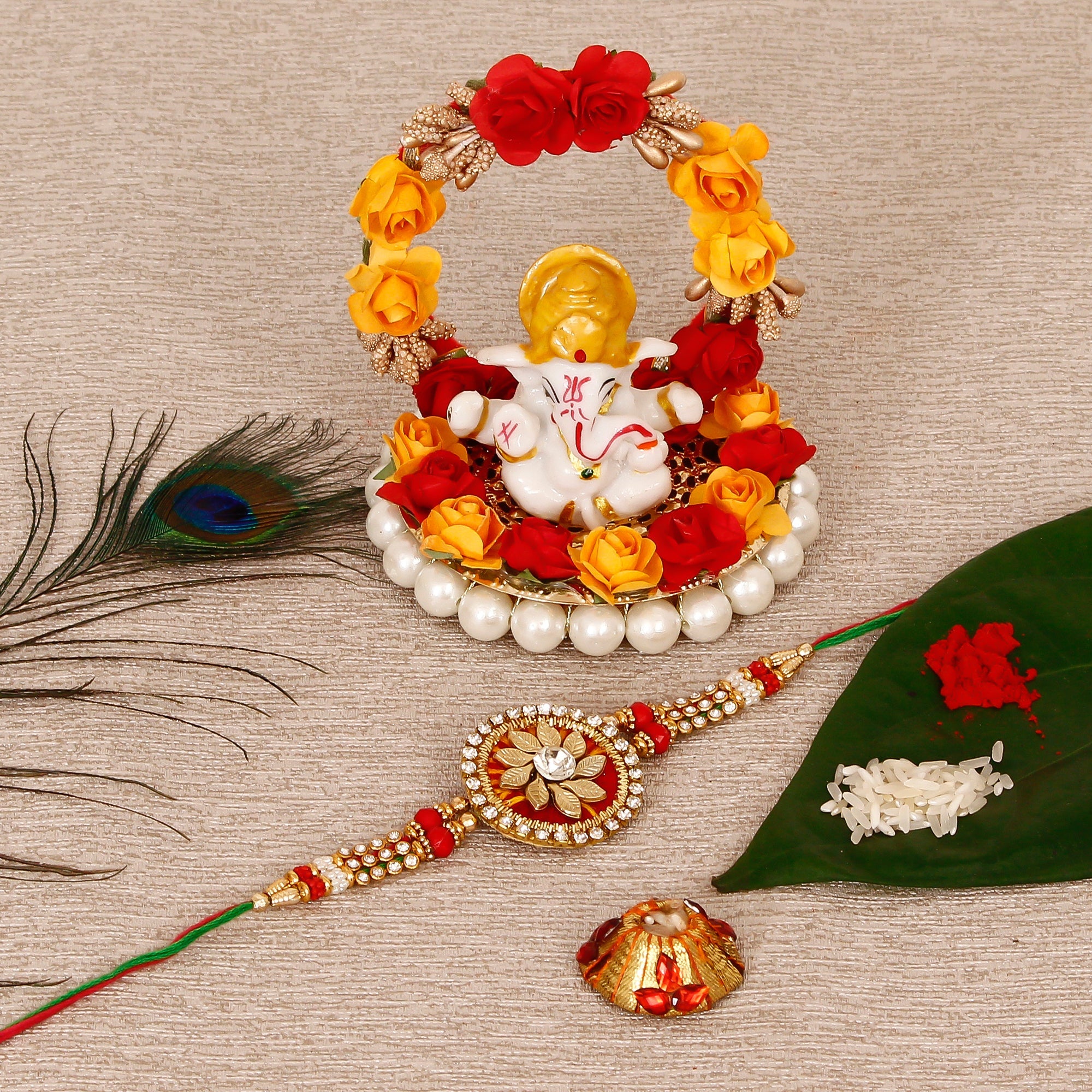 Designer Rakhi with Lord Ganesha Idol on Decorative Plate for Car & Home and Roli Tikka Matki Kafalo