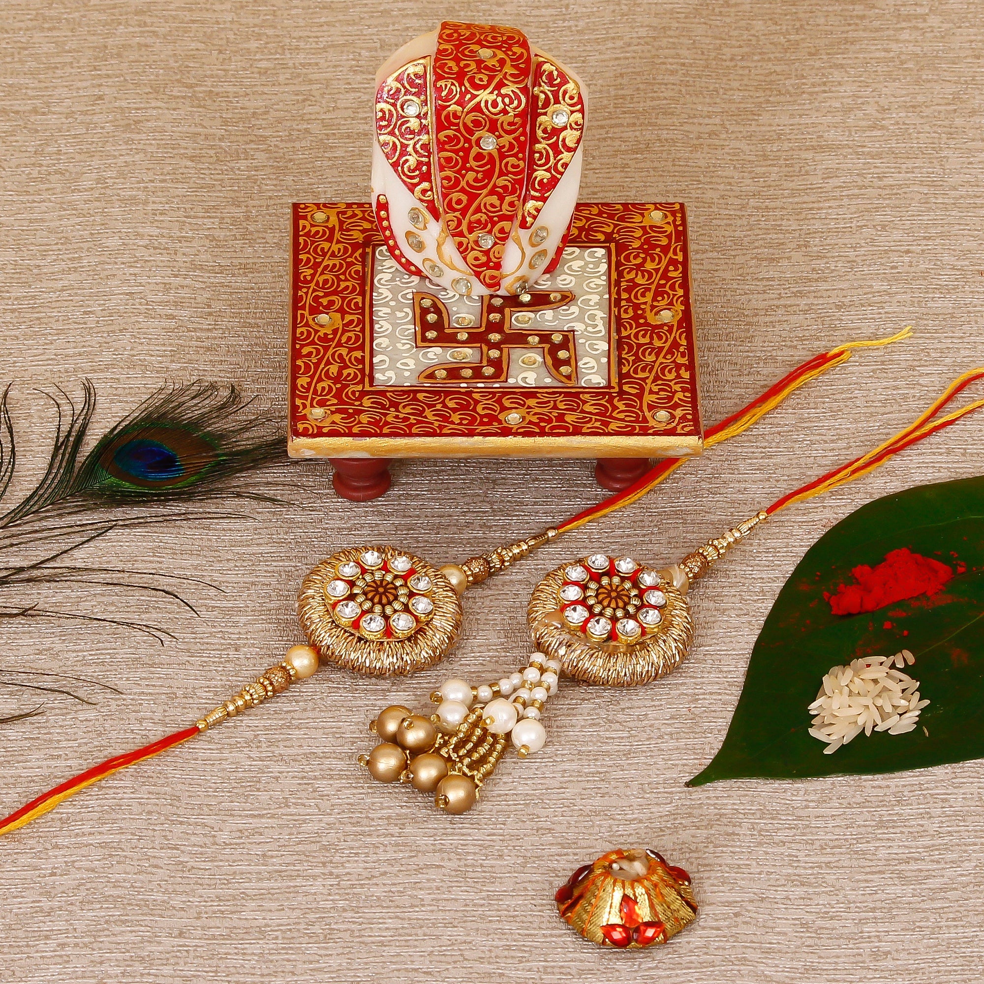 Designer Bhaiya Bhabhi Rakhi with Ridhi Sidhi Marble chowki and Roli Tikka Matki Kafalo