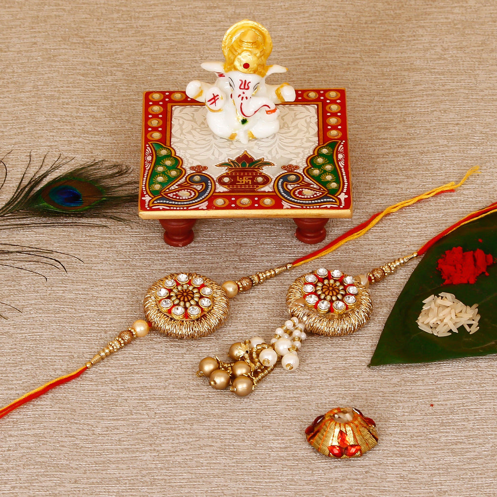 Designer Bhaiya Bhabhi Rakhi with Lord Ganesha Marble Chowki and Roli Tikka Matki Kafalo