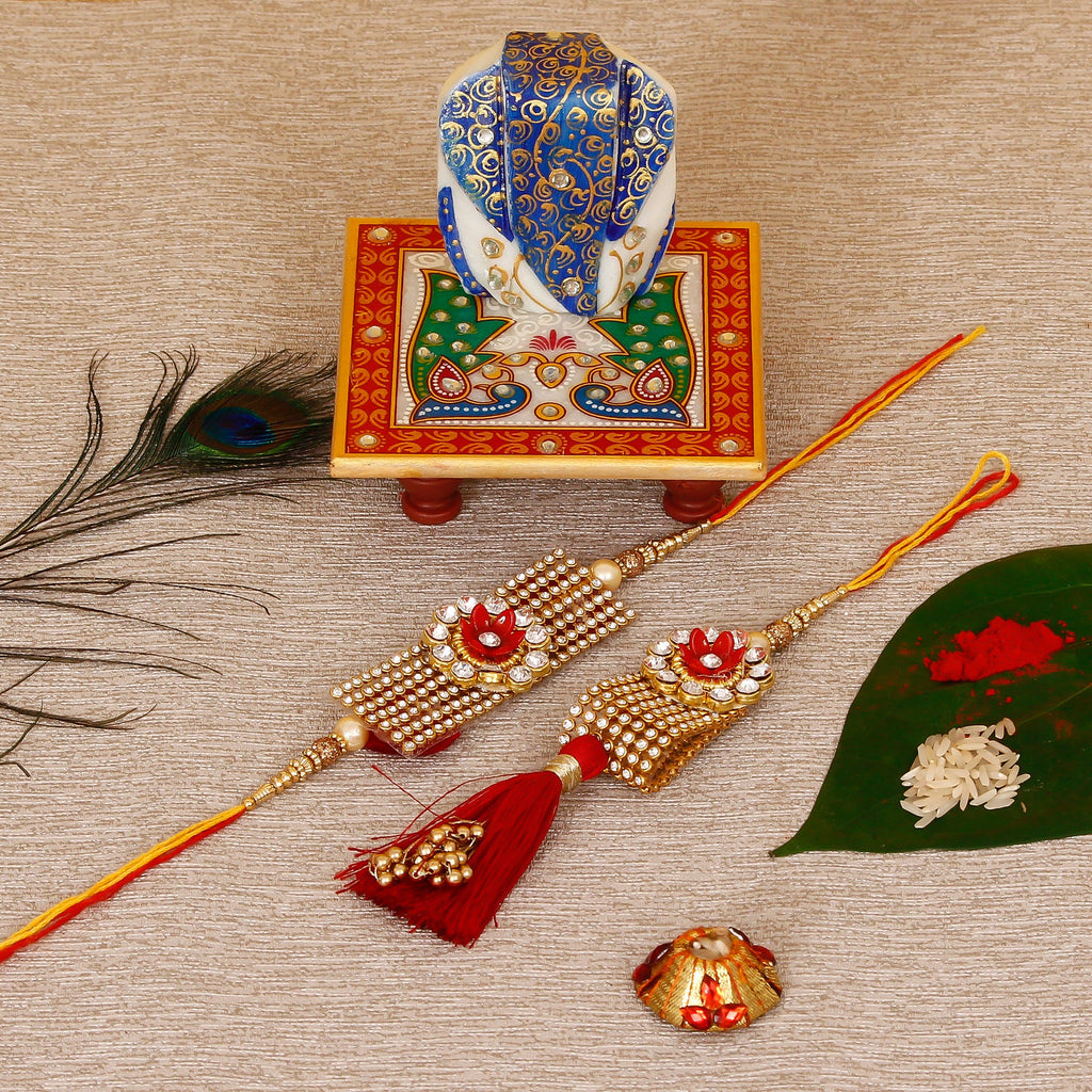Designer Bhaiya Bhabhi Rakhi with Lord Ganesha on Marble Chowki and Roli Tikka Matki Kafalo