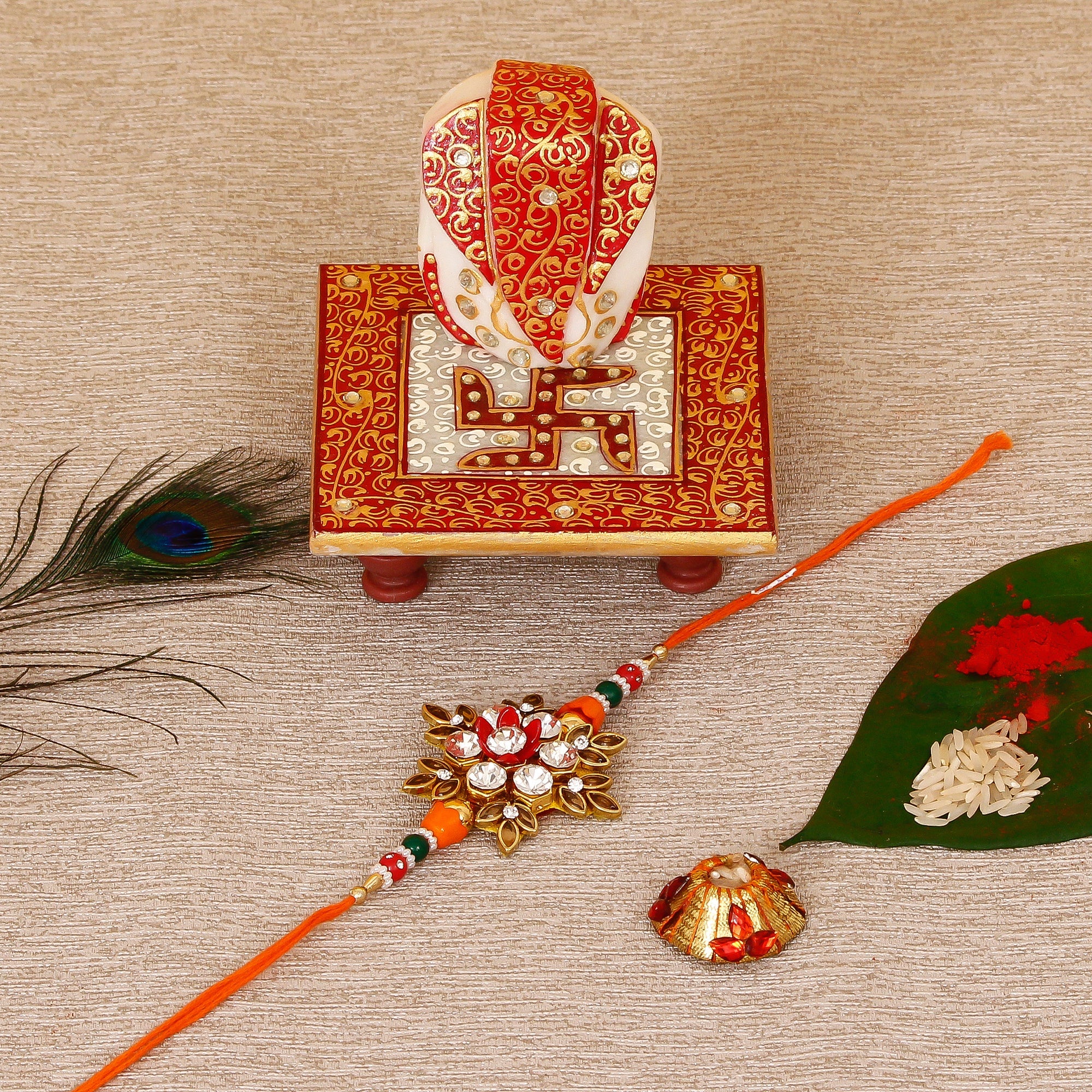 Designer Rakhi with Ridhi Sidhi Marble chowki and Roli Tikka Matki Kafalo