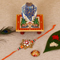 Designer Rakhi with Lord Ganesha on Marble Chowki and Roli Tikka Matki Kafalo