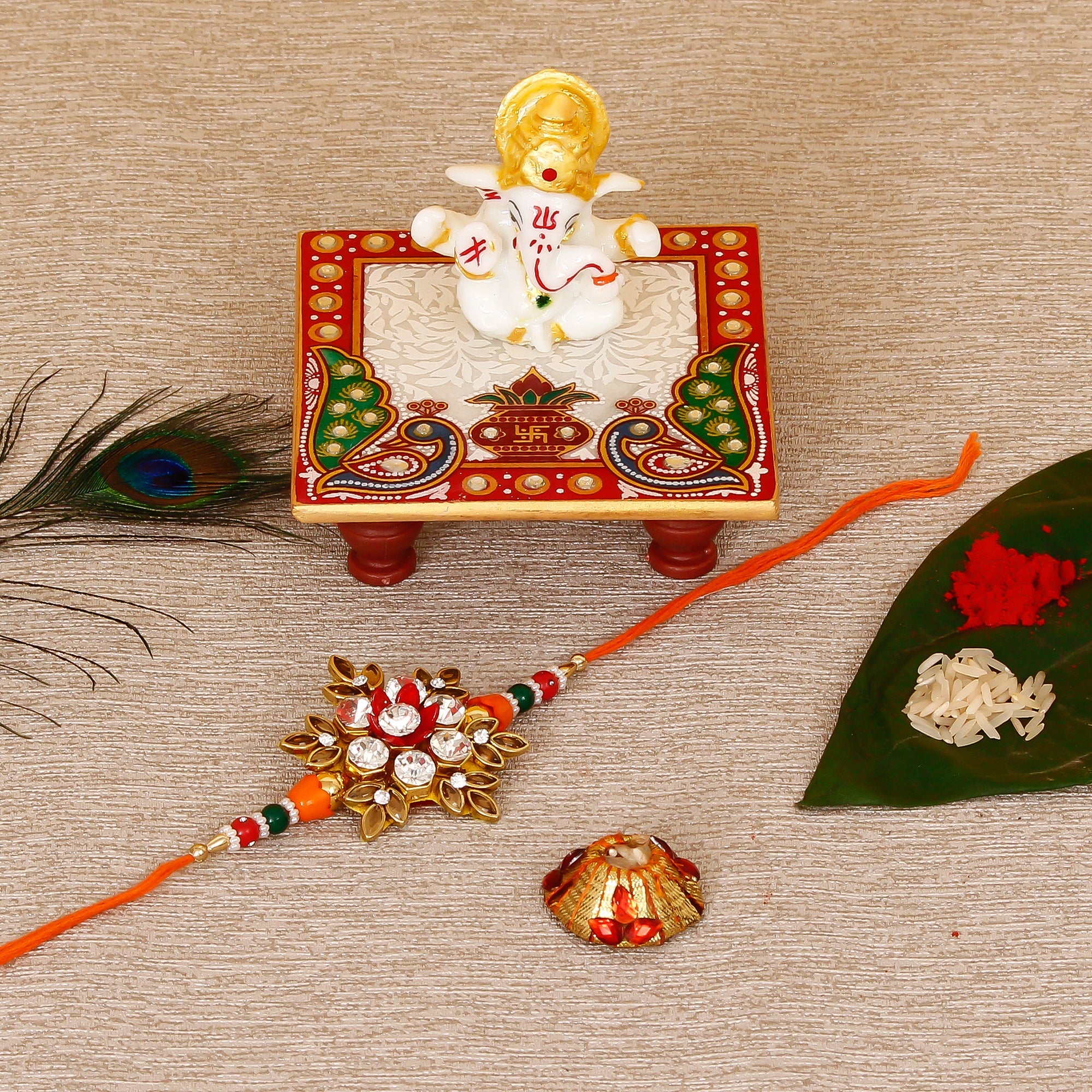 Designer Rakhi with Lord Ganesha Marble Chowki and Roli Tikka Matki Kafalo