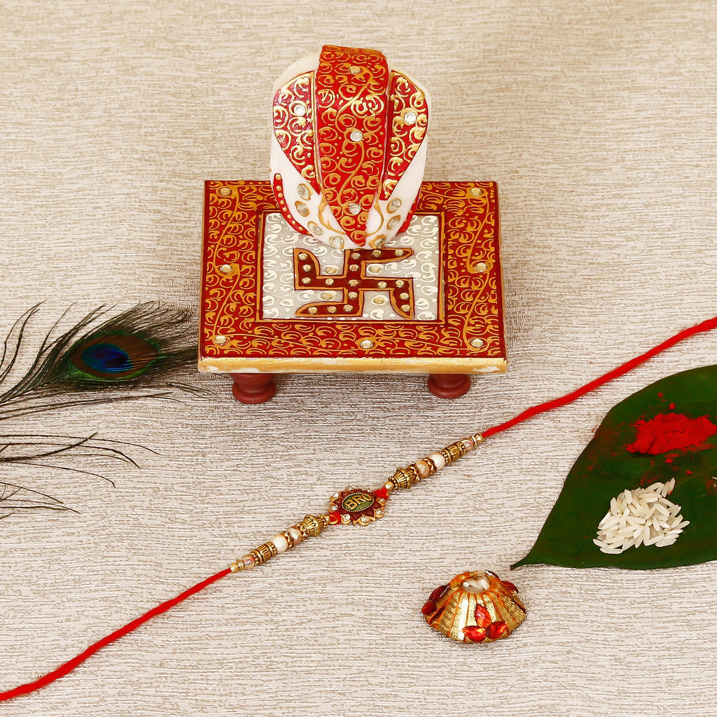 Designer Rakhi with Ridhi Sidhi Marble chowki and Roli Tikka Matki Kafalo