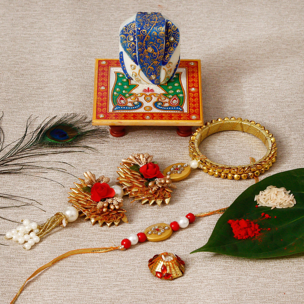 Designer Bhaiya Bhabhi Rakhi with Lord Ganesha on Marble Chowki and Roli Tikka Matki Kafalo