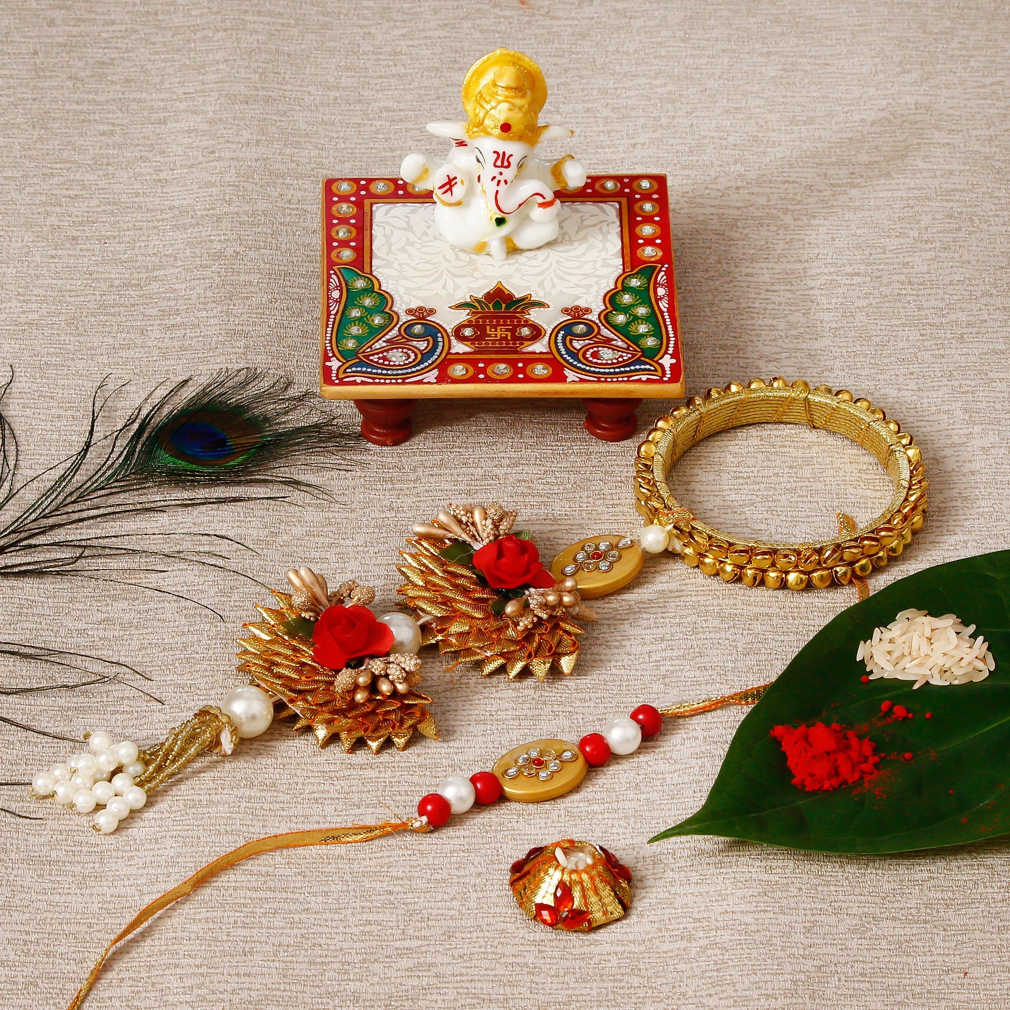 Designer Bhaiya Bhabhi Rakhi with Lord Ganesha Marble Chowki and Roli Tikka Matki Kafalo