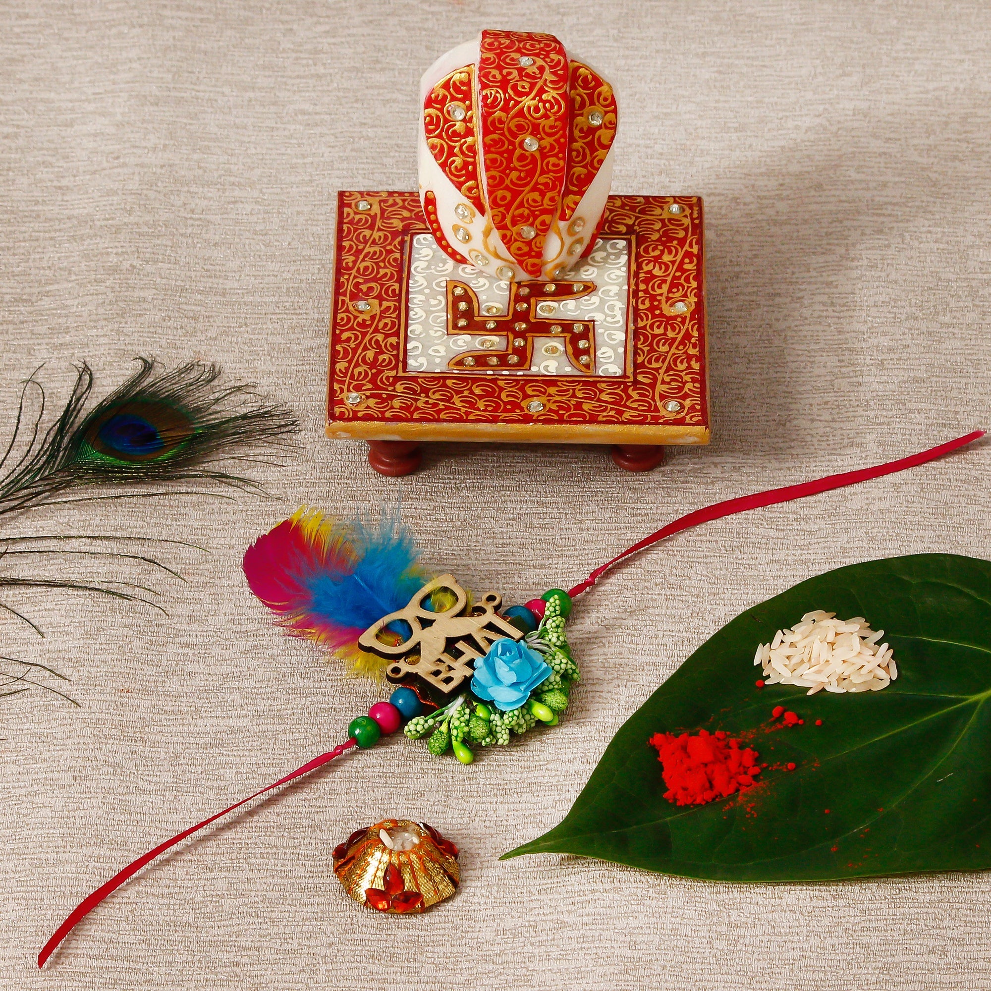 Designer Rakhi with Ridhi Sidhi Marble chowki and Roli Tikka Matki Kafalo