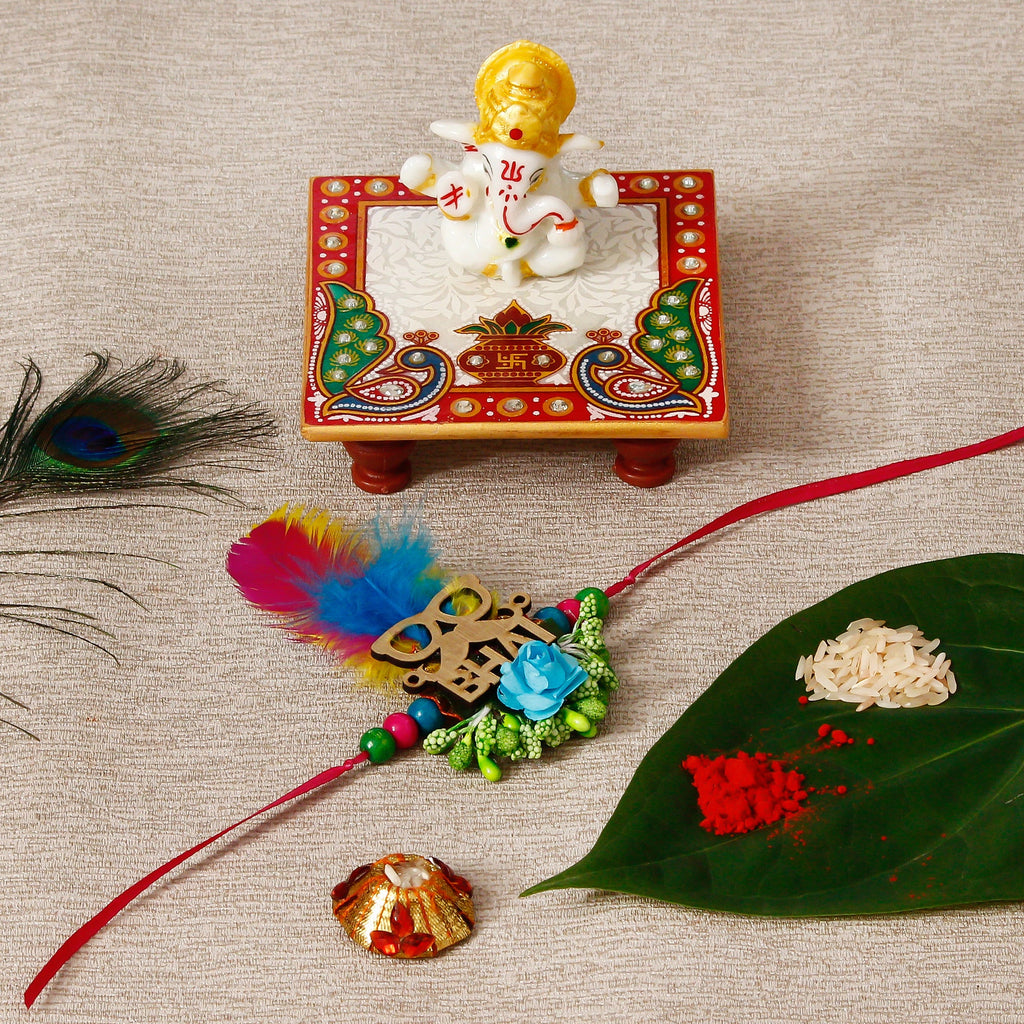 Designer Rakhi with Lord Ganesha Marble Chowki and Roli Tikka Matki Kafalo