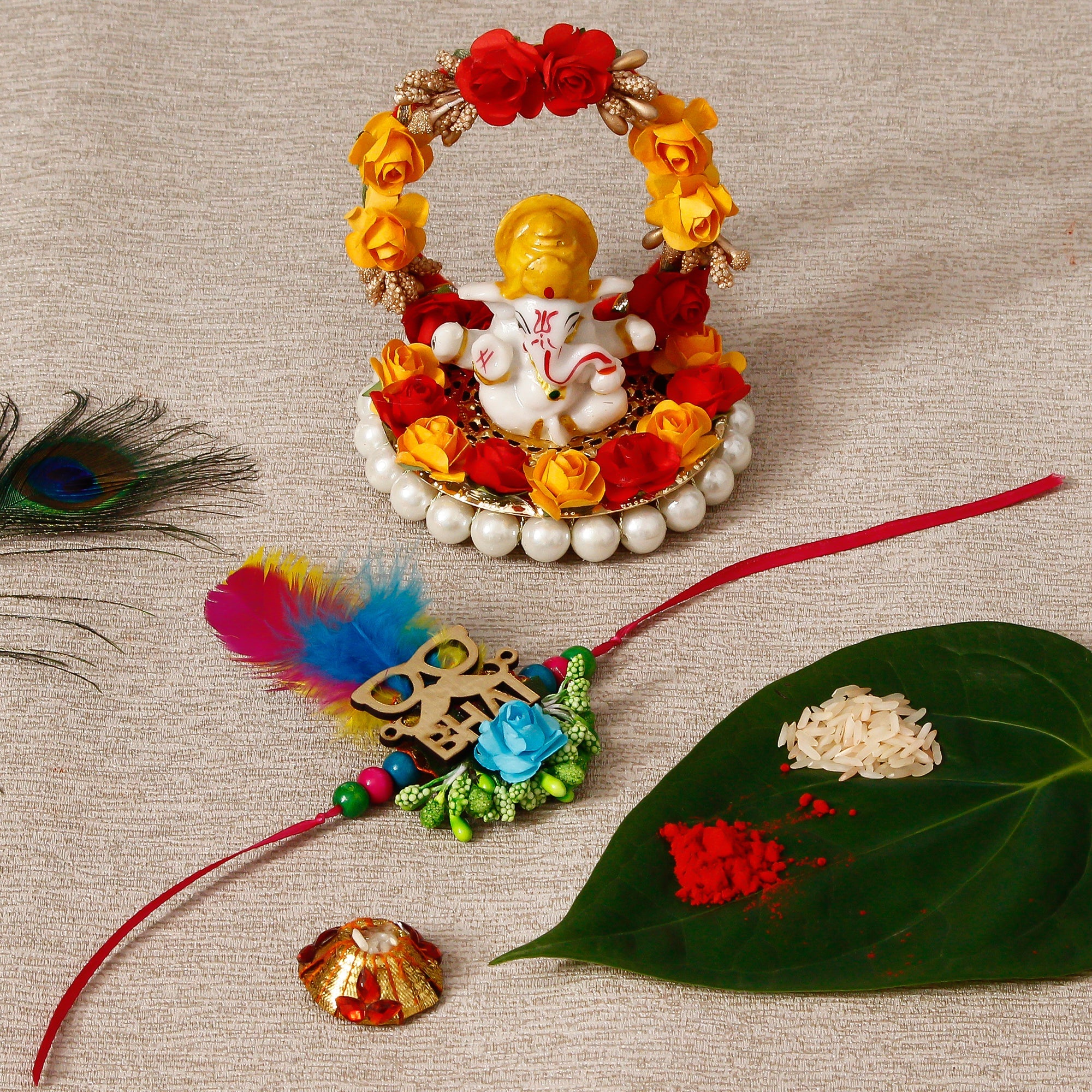 Designer Rakhi with Lord Ganesha Idol on Decorative Plate for Car & Home and Roli Tikka Matki Kafalo