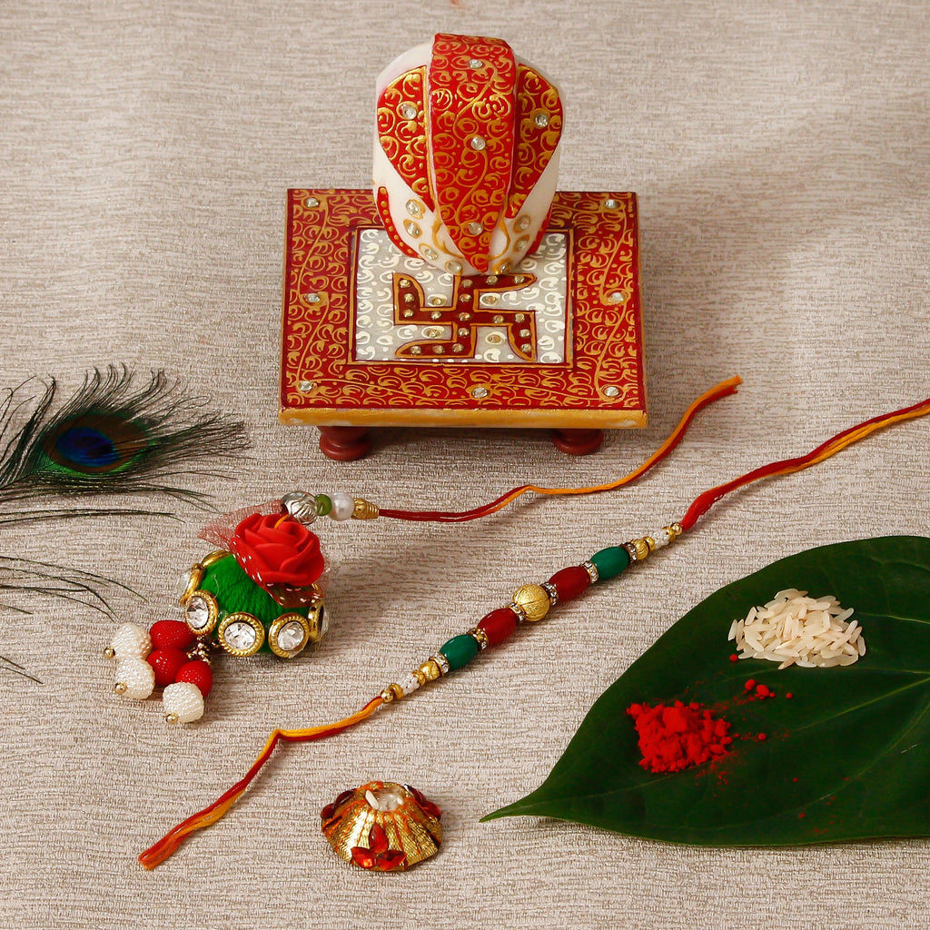 Designer Bhaiya Bhabhi Rakhi with Ridhi Sidhi Marble chowki and Roli Tikka Matki Kafalo
