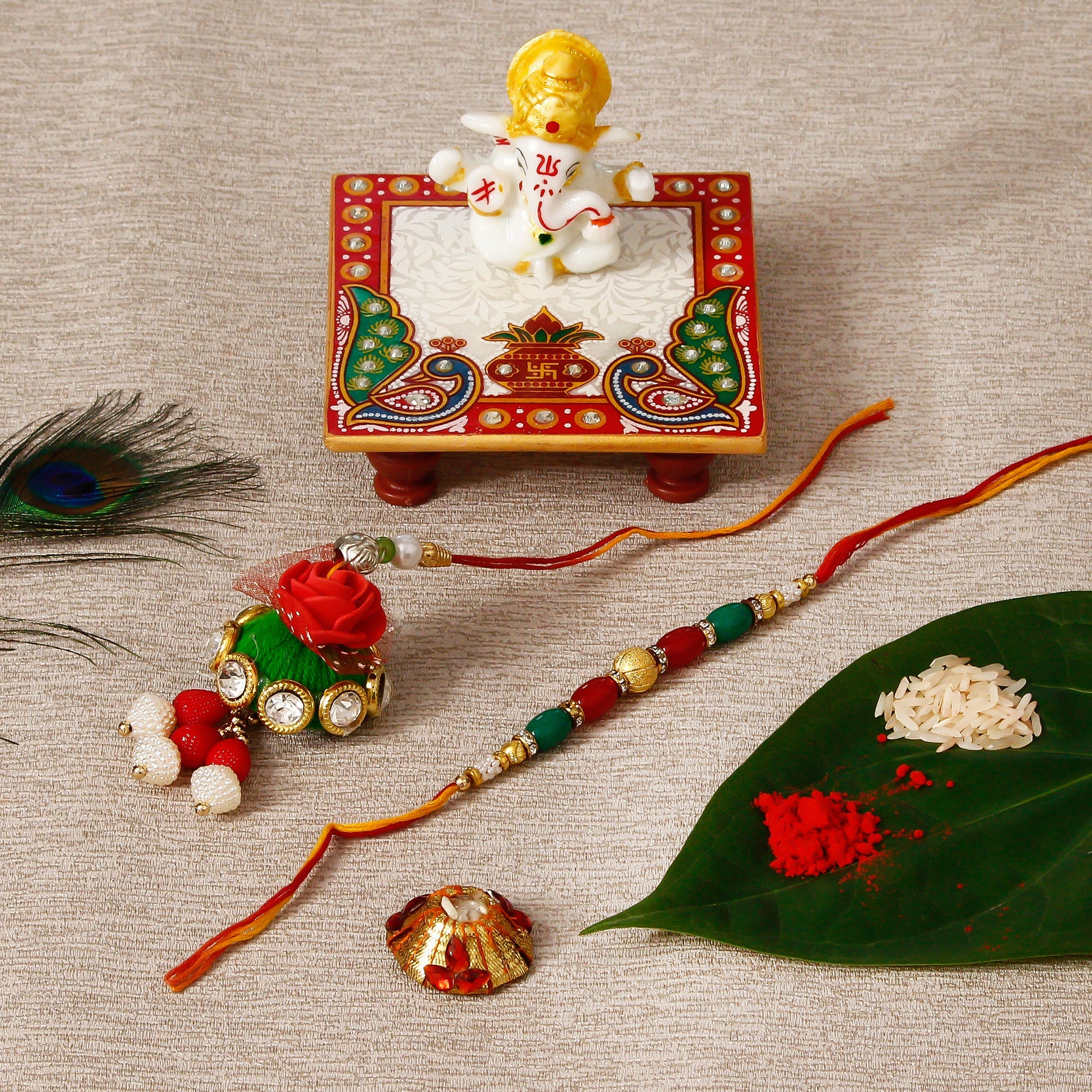 Designer Bhaiya Bhabhi Rakhi with Lord Ganesha Marble Chowki and Roli Tikka Matki Kafalo