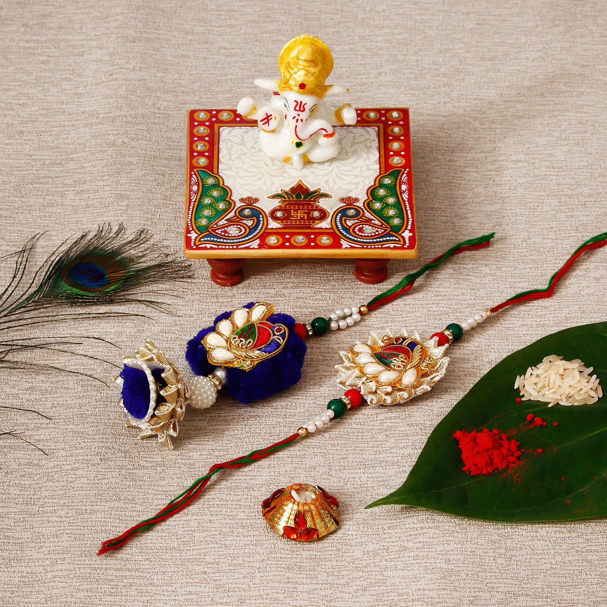 Designer Bhaiya Bhabhi Rakhi with Lord Ganesha Marble Chowki and Roli Tikka Matki Kafalo