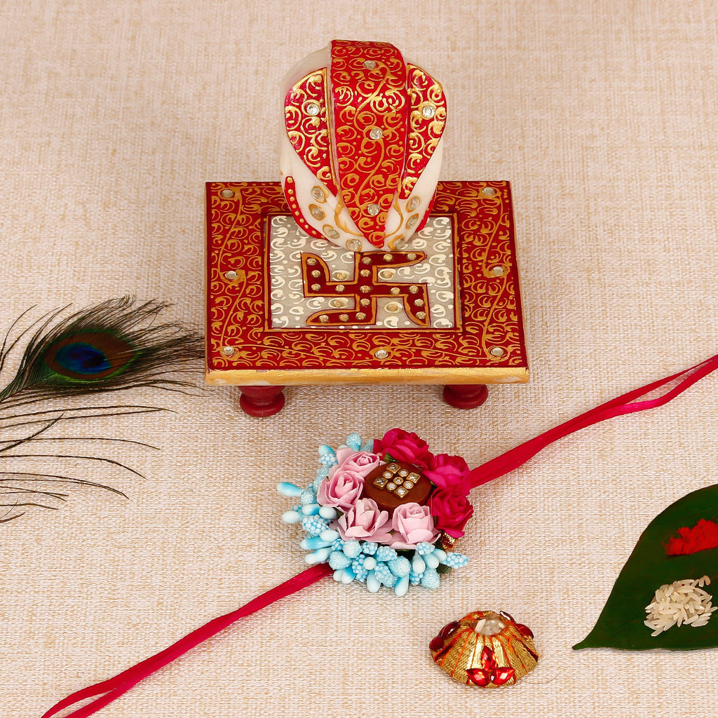 Designer Floral Rakhi with Ridhi Sidhi Marble chowki and Roli Tikka Matki Kafalo