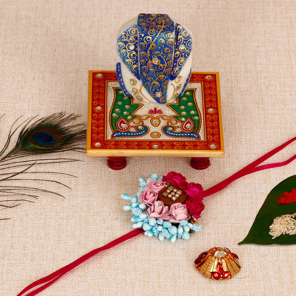 Designer Floral Rakhi with Lord Ganesha on Marble Chowki and Roli Tikka Matki Kafalo